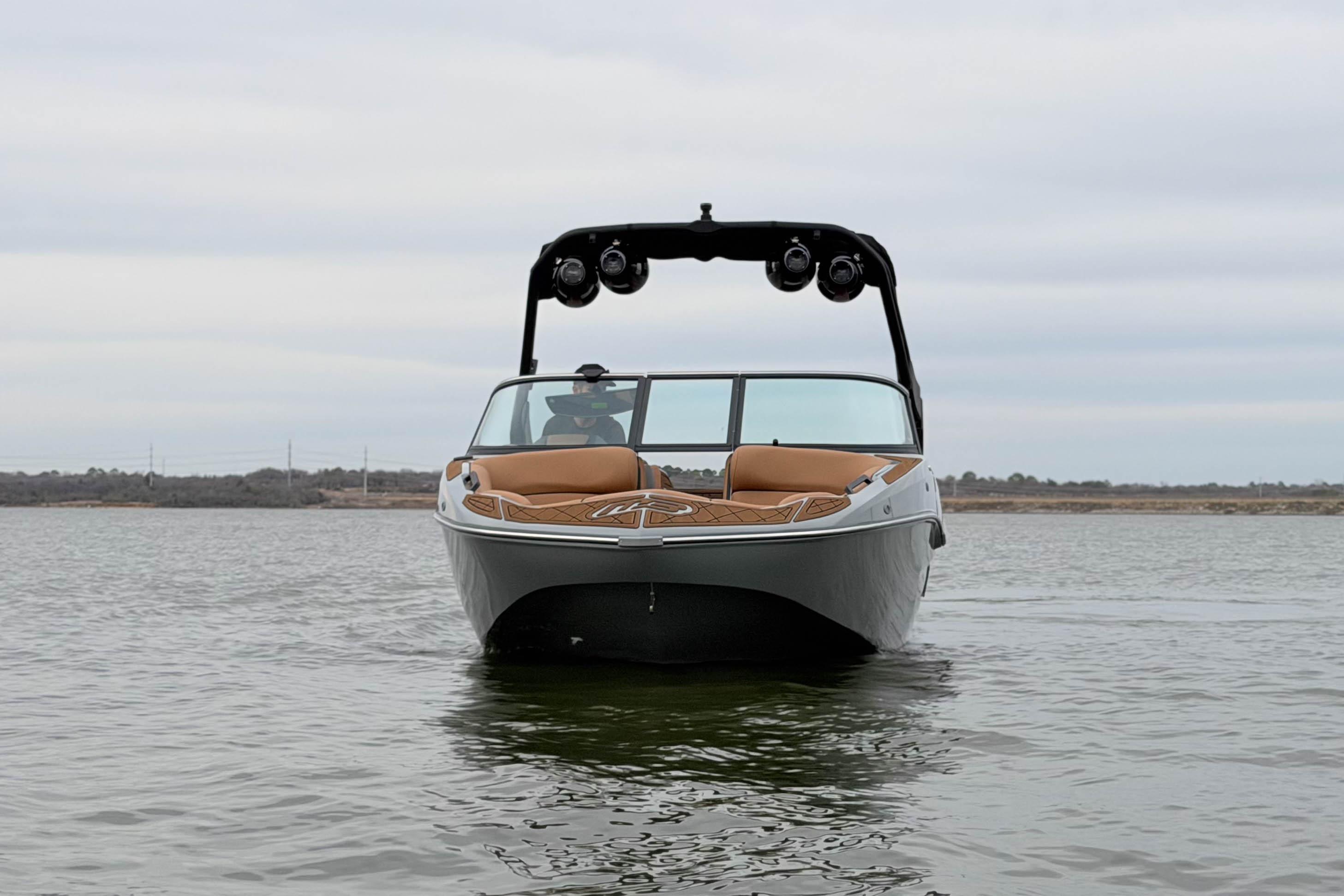 2026 MB B52 21 Alpha boat on calm water, front view.