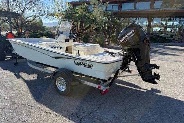 2026 Mako Pro Skiff 15 CC boat with Mercury engine on trailer.