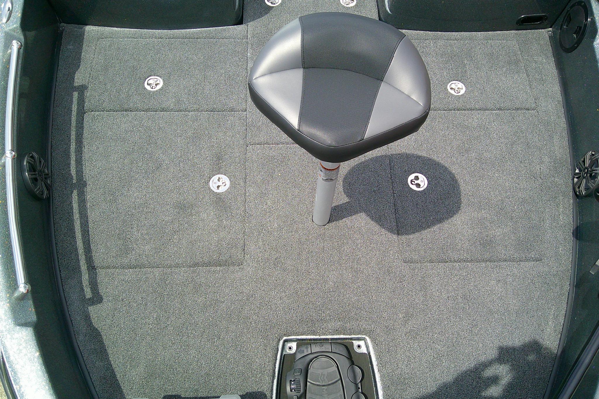Interior of 2026 Nitro ZV19 Sport boat with gray carpet and swivel seat.