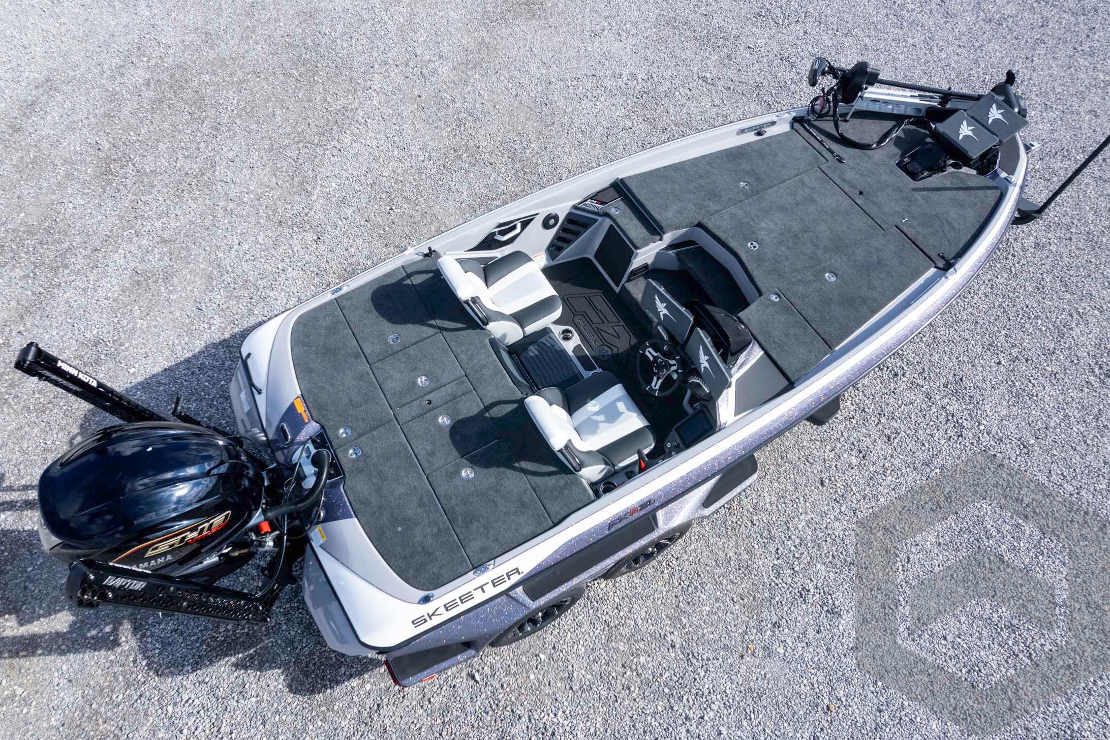 2026 Skeeter FXR20 FLEX fishing boat, aerial view on gravel surface.