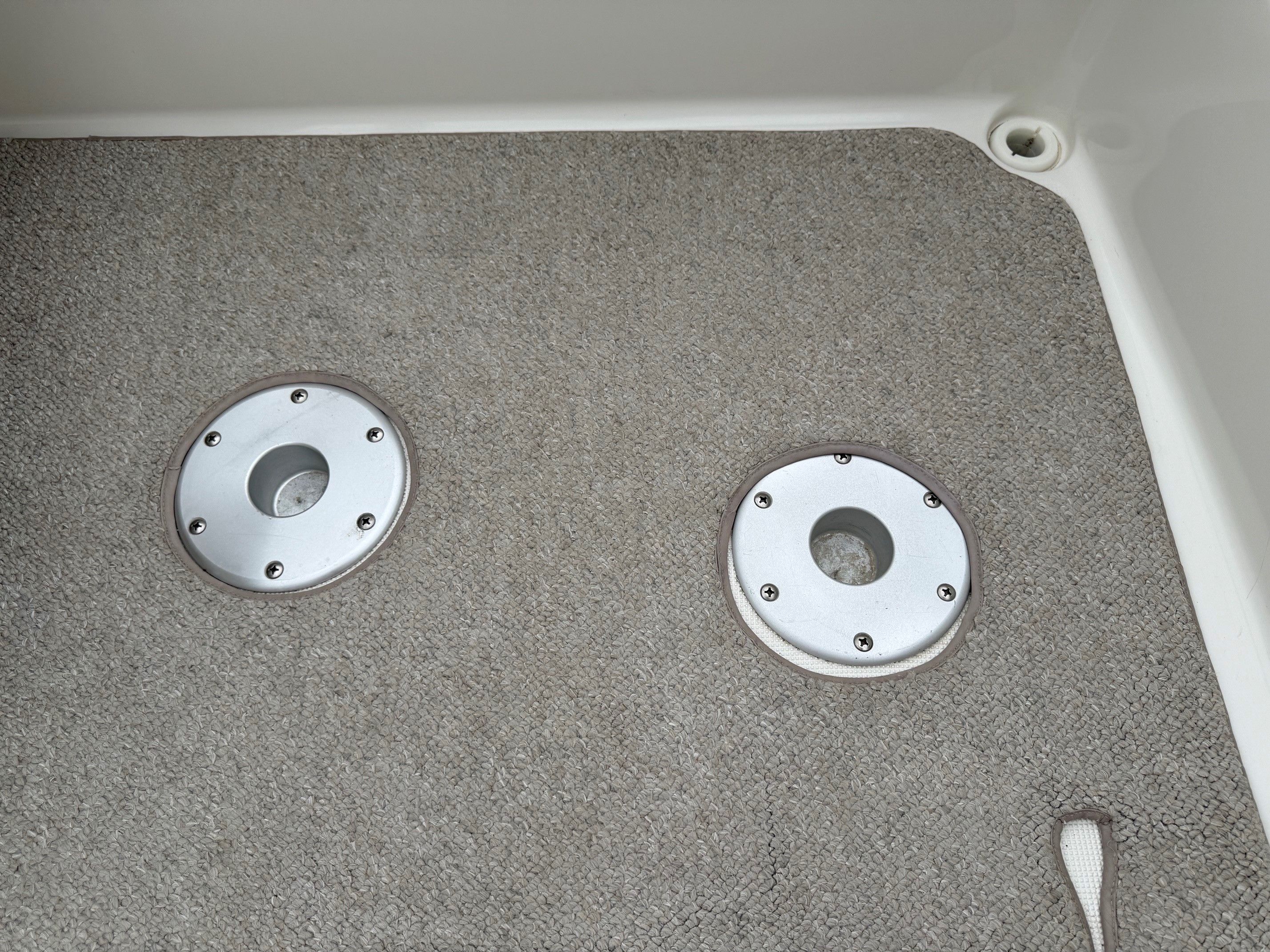 Interior of a 1998 Formula Thunderbird boat with carpeted floor.