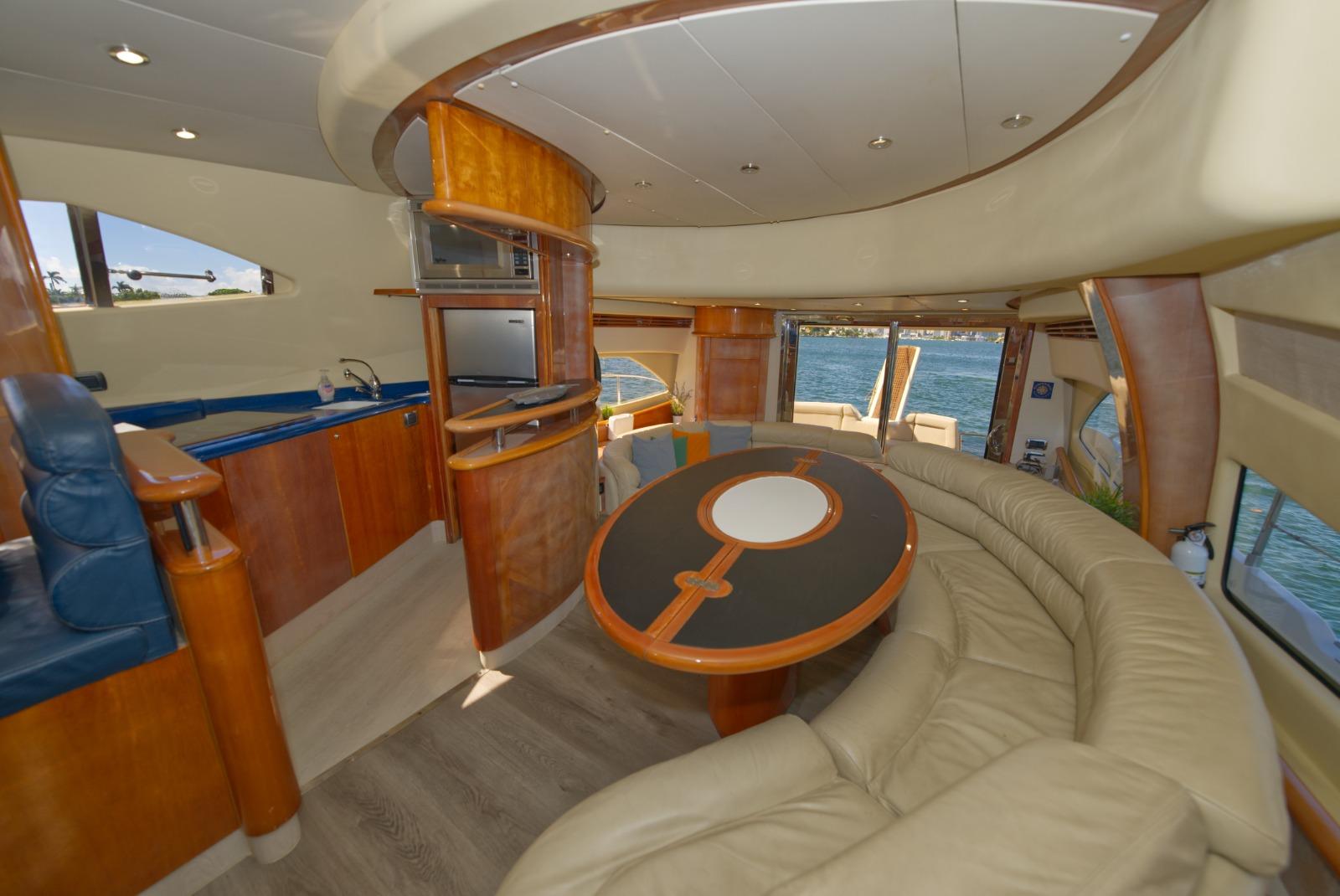 Luxurious interior of 2003 Aicon 56 yacht with elegant seating and modern amenities.