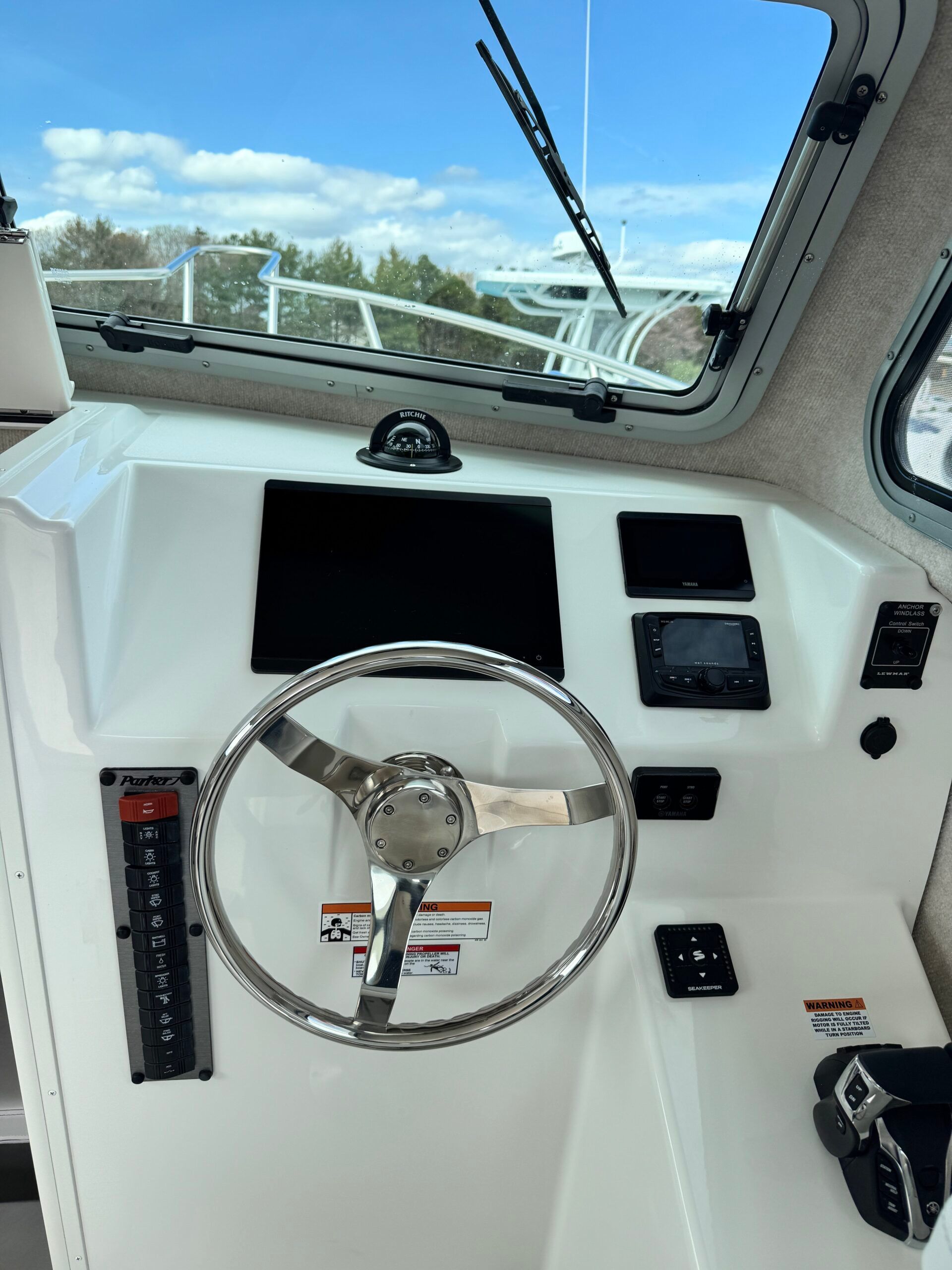 The cockpit of the 2021 Regal 26 Express features a modern steering wheel and instruments.