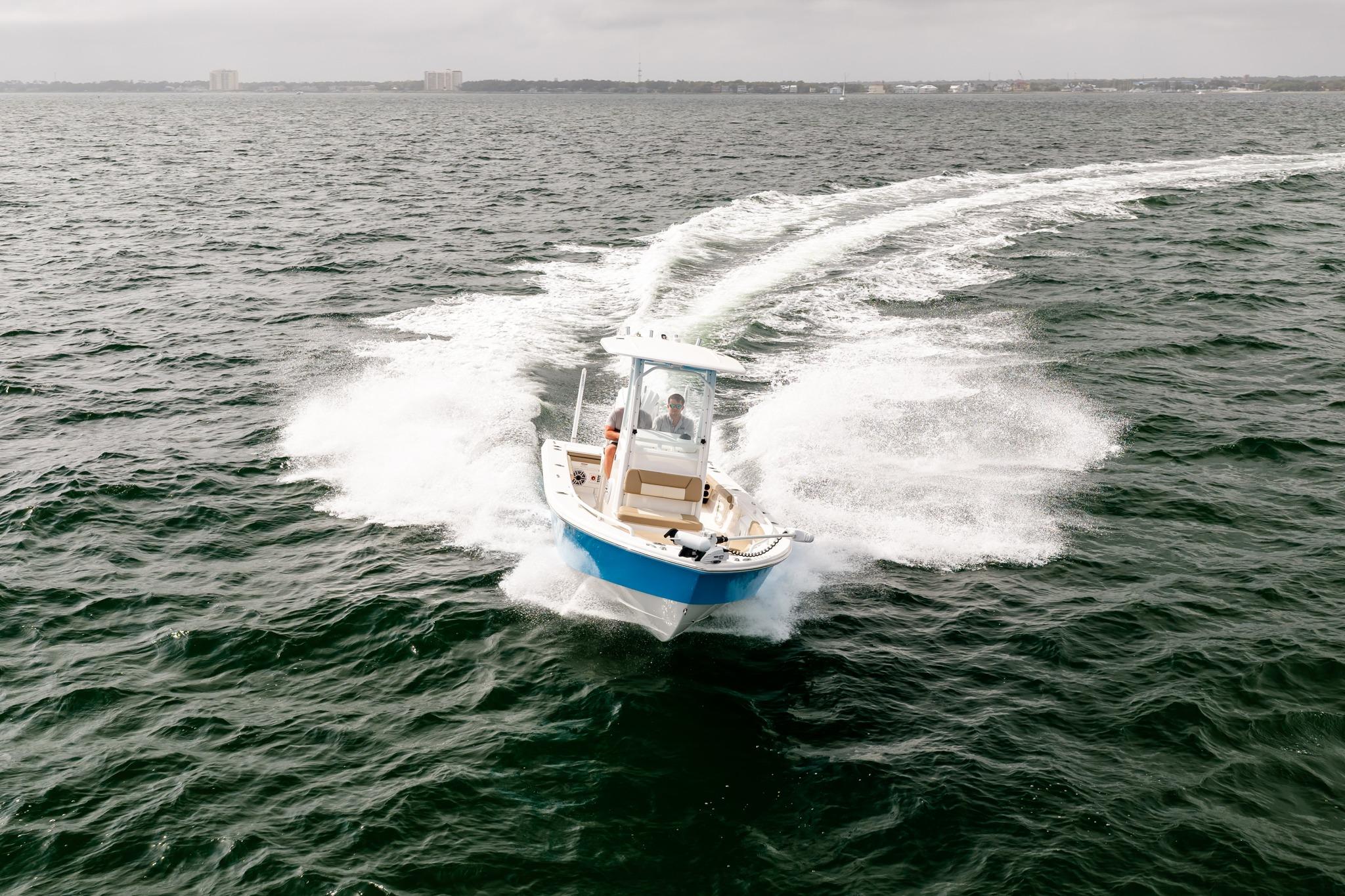 2023 Everglades 243 Center Console boat cruising on open water.