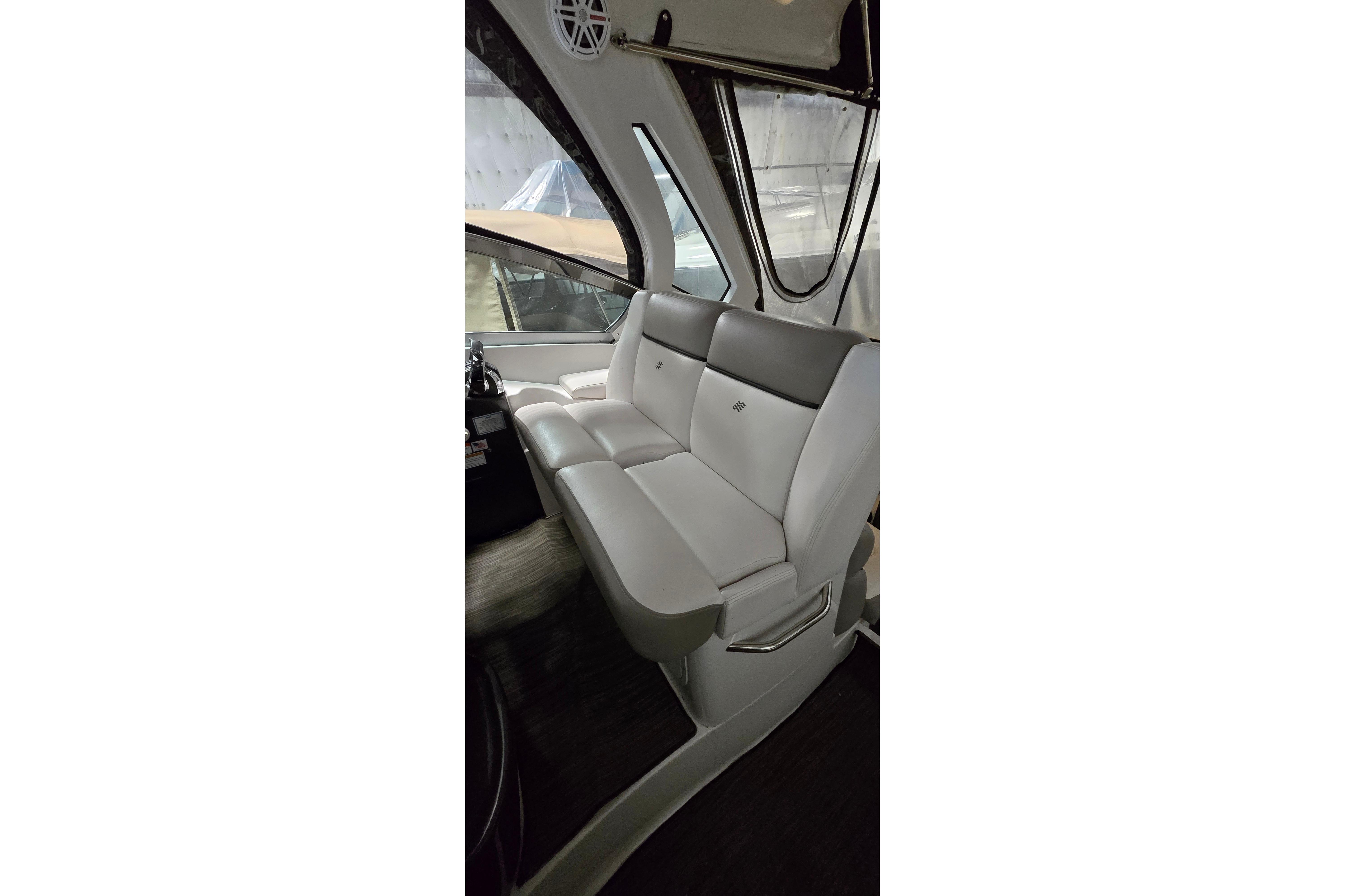 Interior of 2018 Four Winns V355 boat with sleek white seating and modern design.