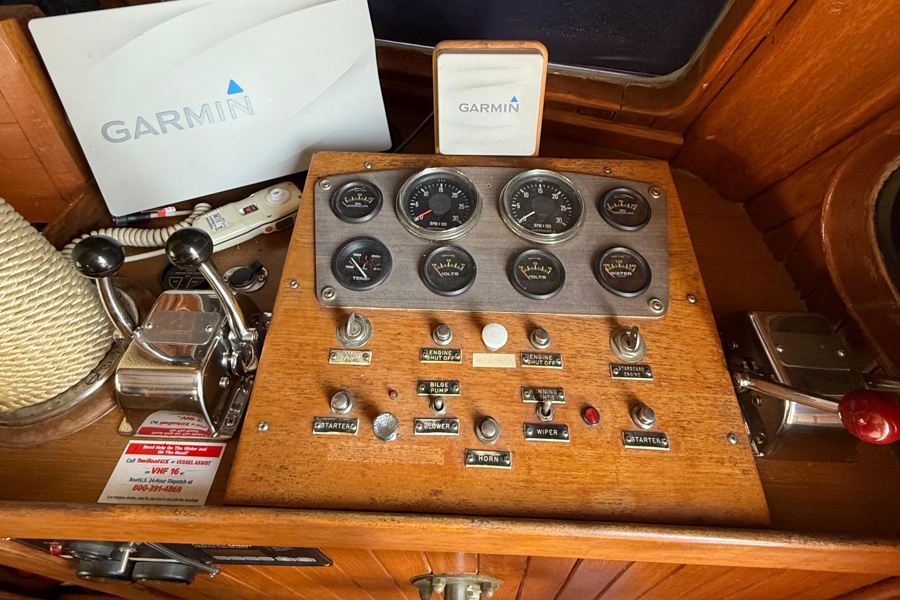 Control panel of a 1978 DeFever 39 boat with Garmin navigation equipment.