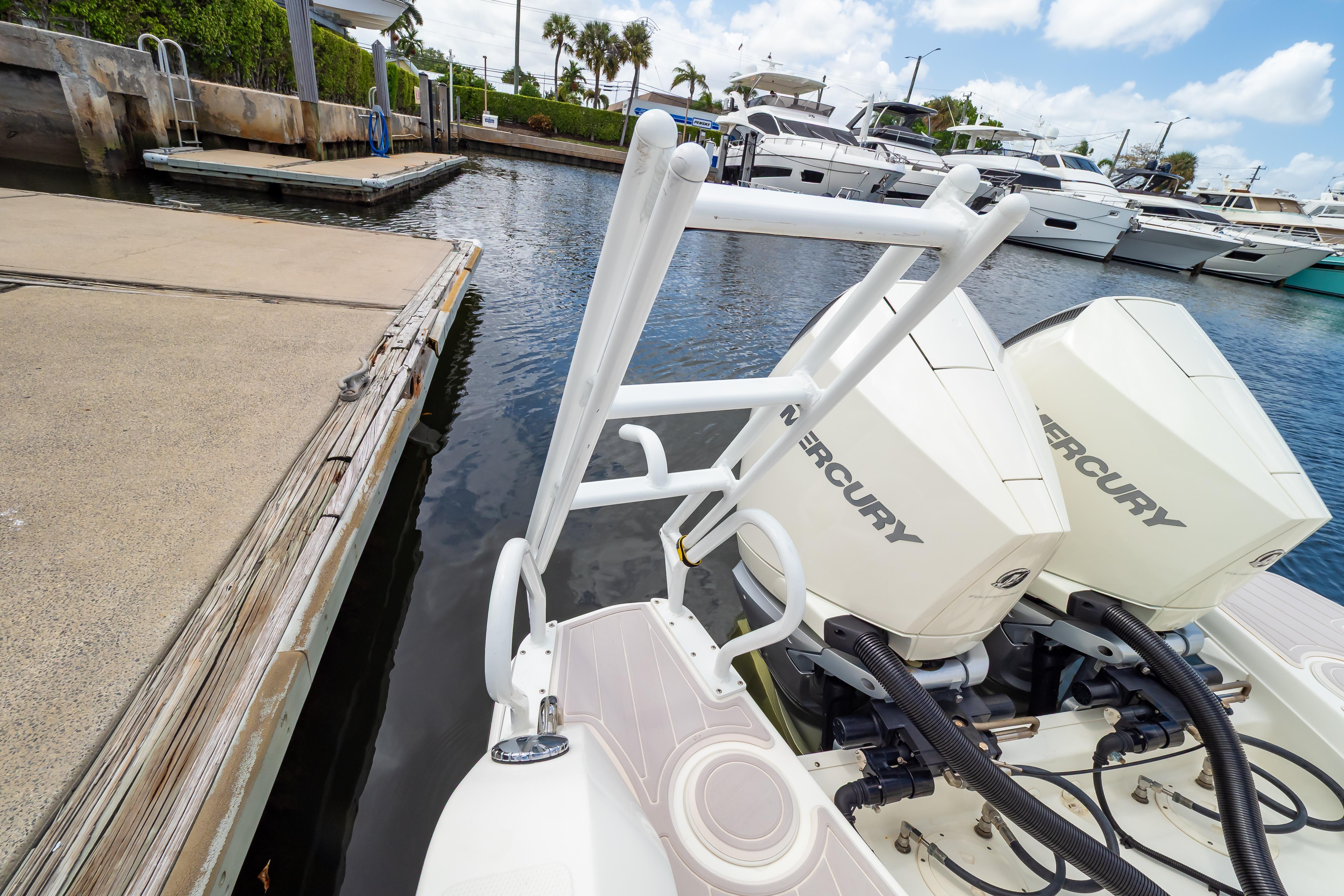 2019 Boston Whaler 270 Vantage with Mercury engines docked at marina.
