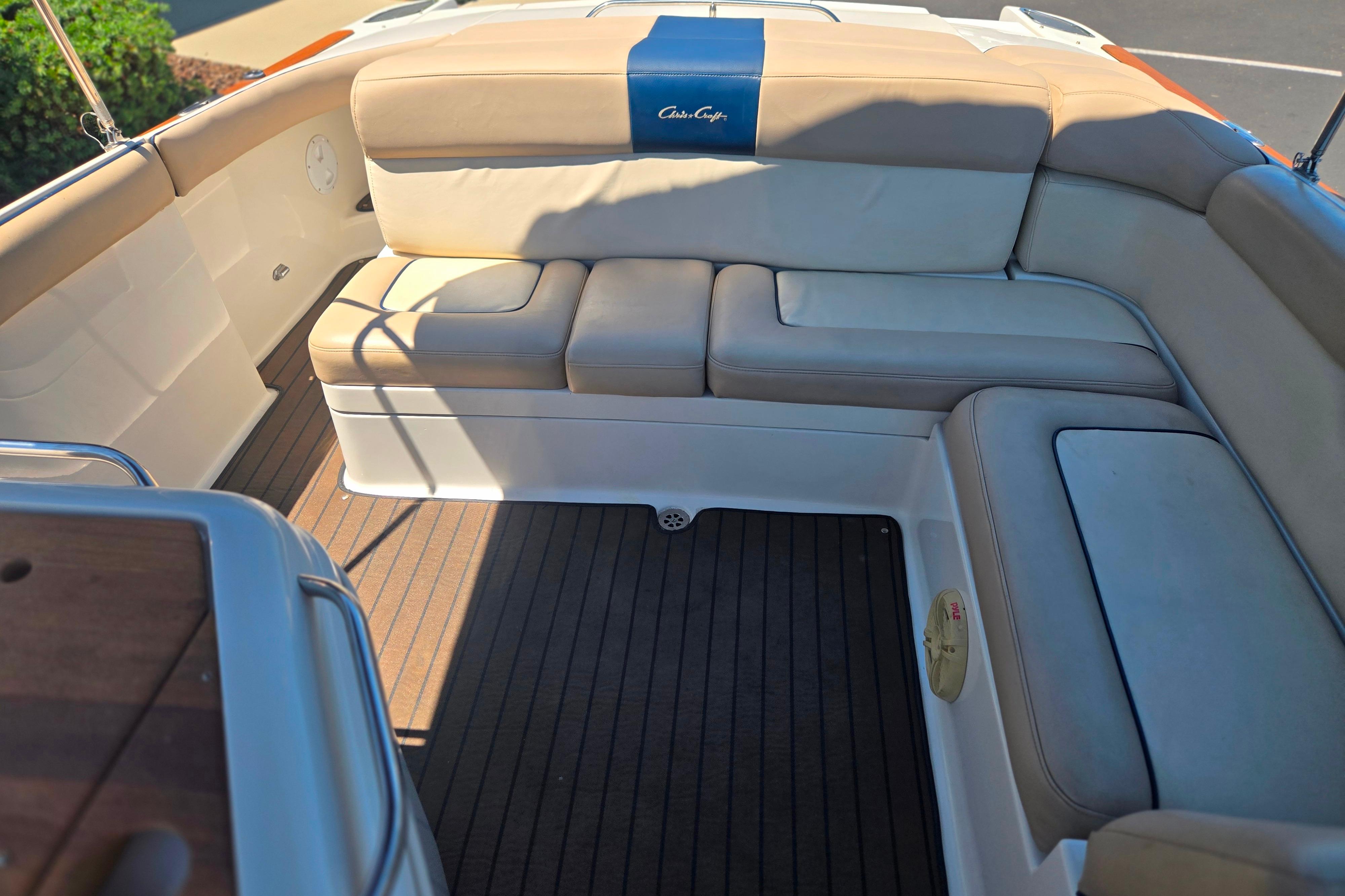 Luxurious seating on 2002 Chris-Craft Launch 28 GT I/O boat with elegant upholstery.
