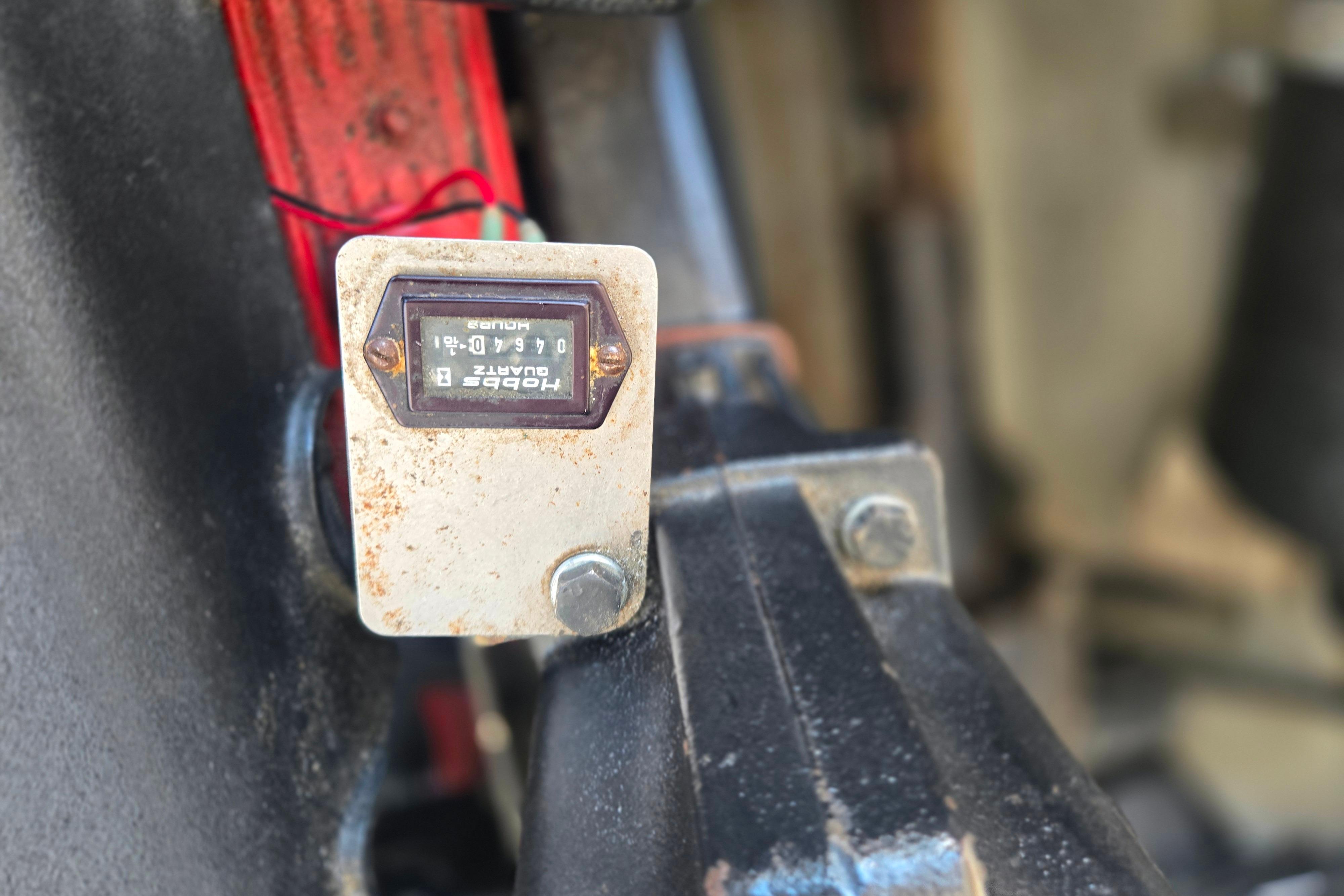 Close-up of a Hobbs hour meter on a 2002 Chris-Craft Launch 28 GT I/O boat.