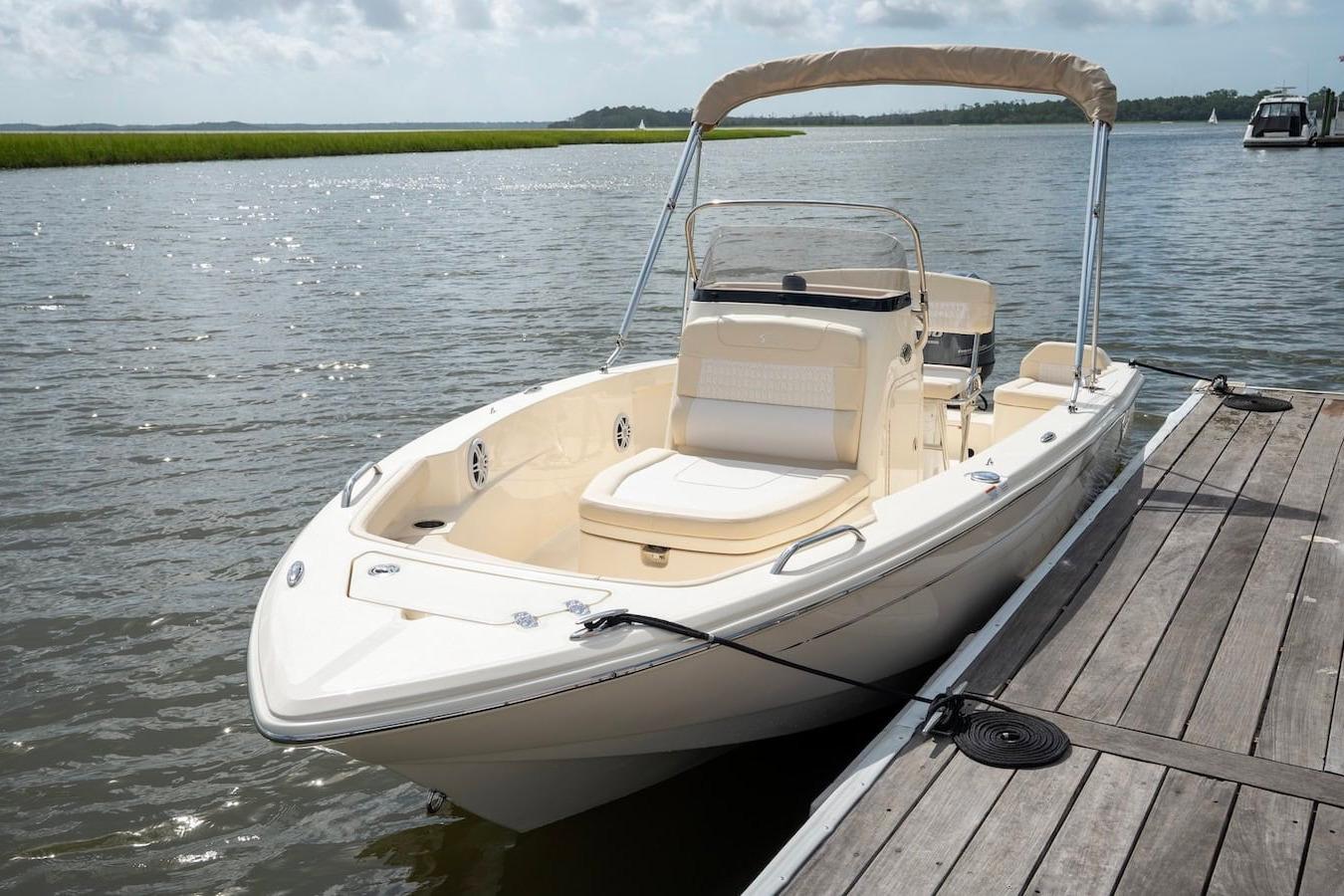 2026 Scout 188 Sportfish boat docked on a sunny day.