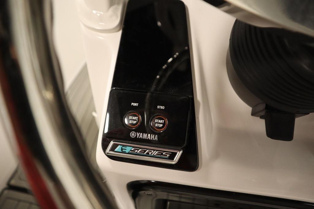 Yamaha Boats 255 FSH Sport E 2026 dashboard with start-stop buttons and E Series logo.
