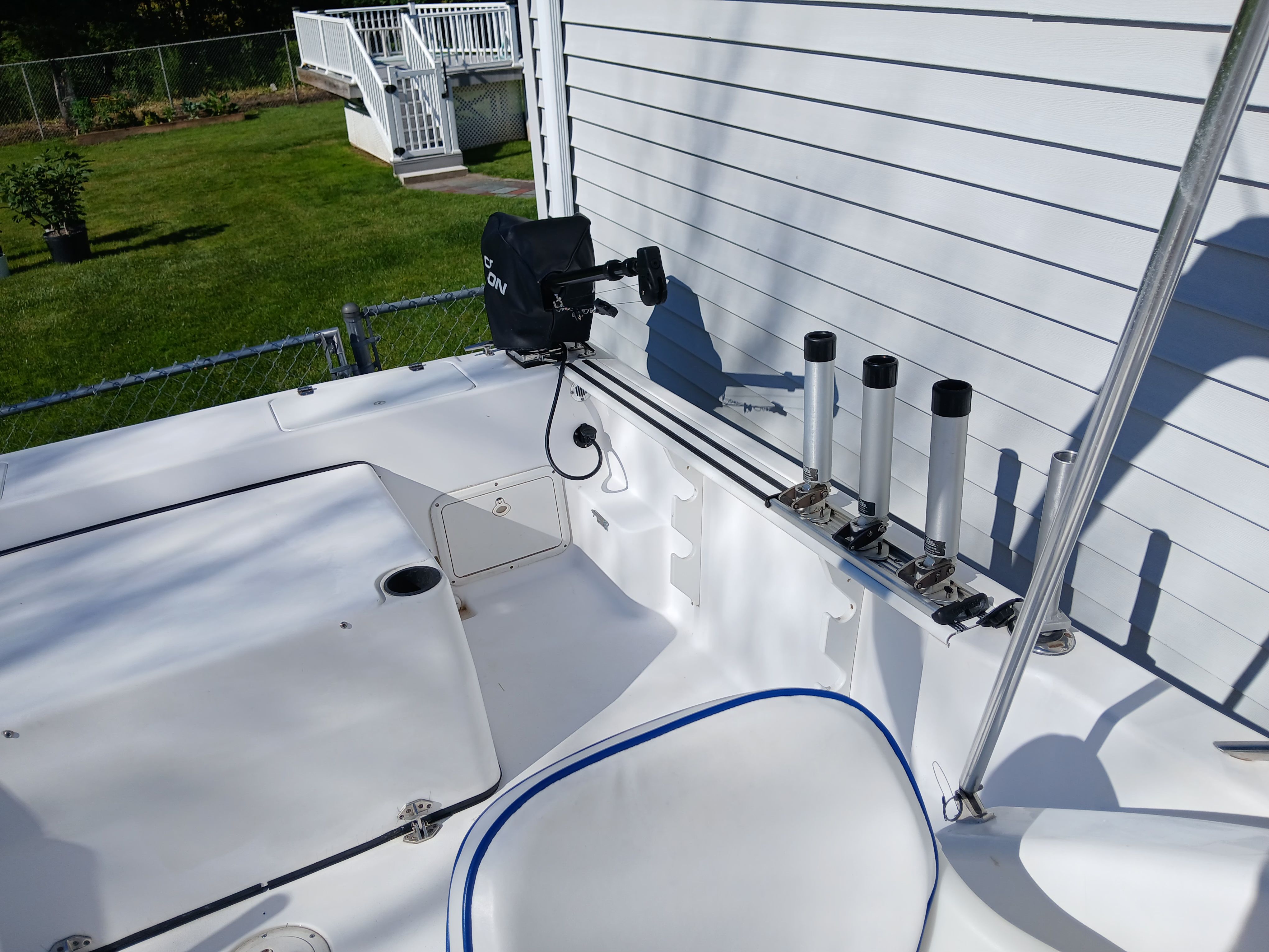 The image shows the deck of a 1999 Pro-Line 201 Walkaround boat. It is clean and well-maintained.