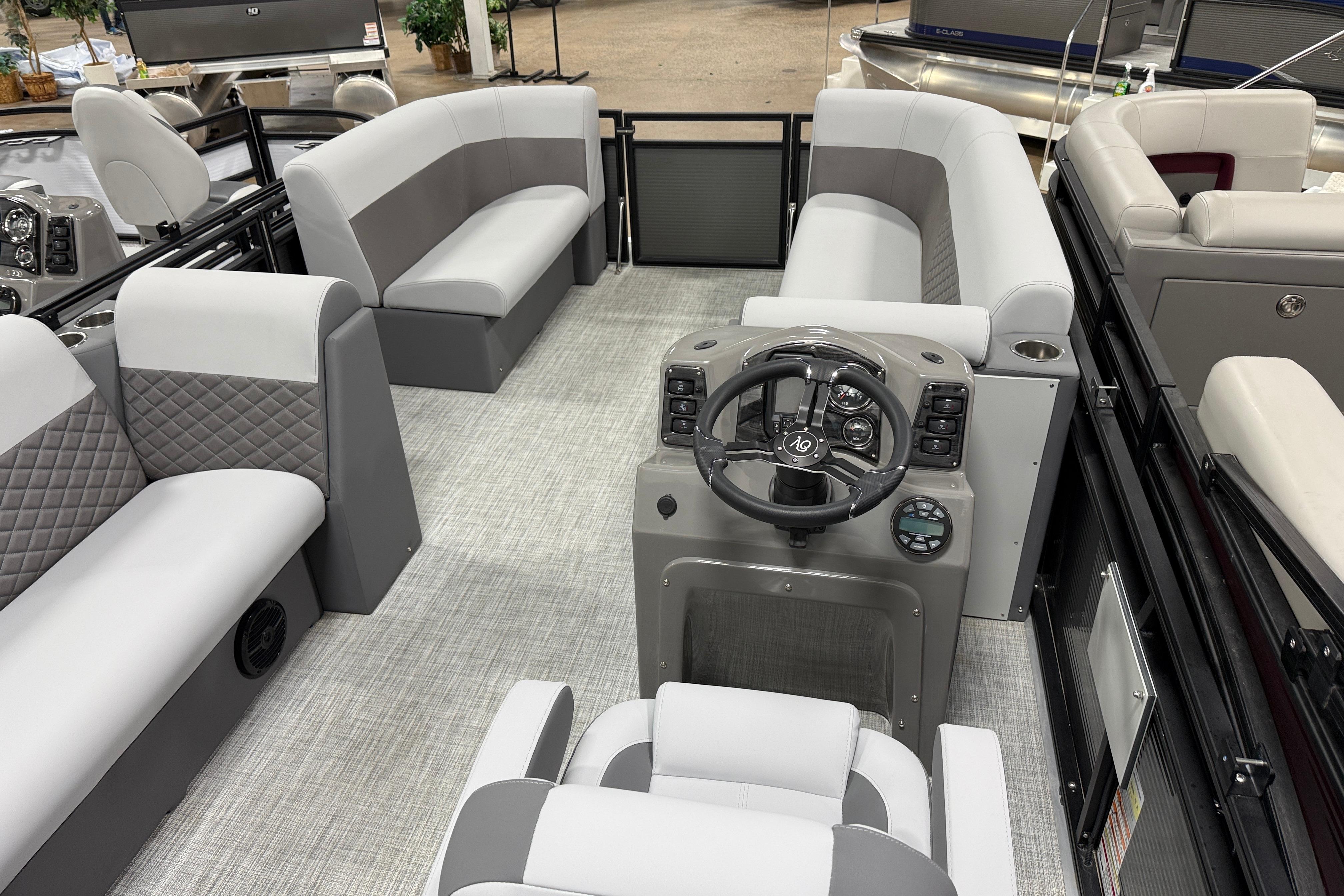 2026 Angler Quest 818 Panfish Cruise interior with modern seating and steering console.