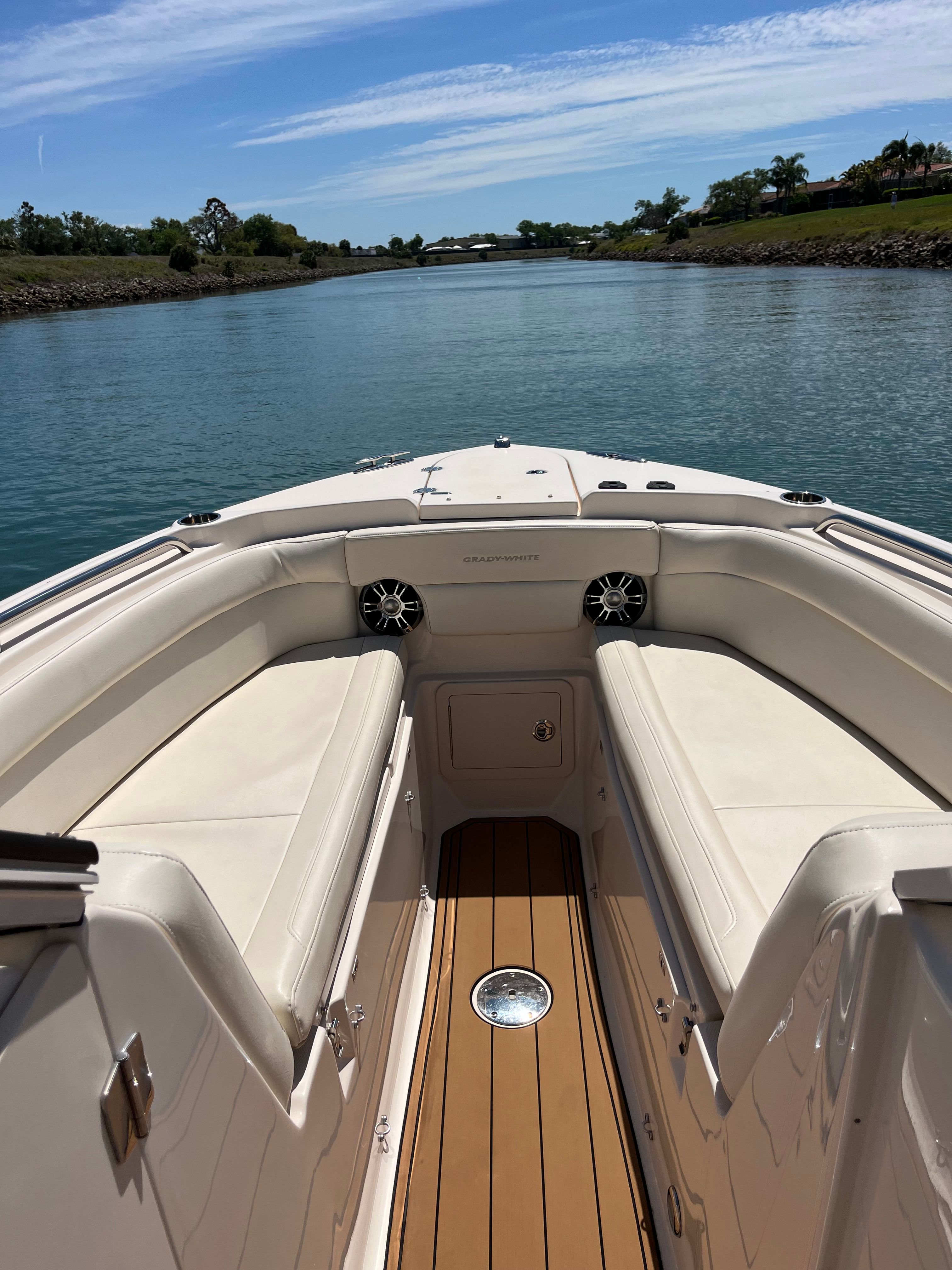 Grady-White Freedom 275 boat, 2022, on calm water.