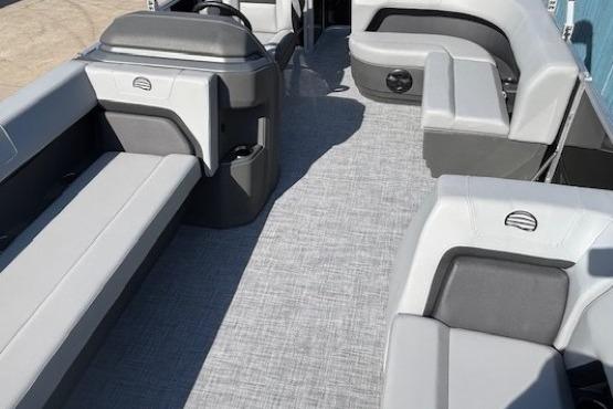 2026 Sun Tracker Party Barge 18 DLX interior with gray seating and modern design.