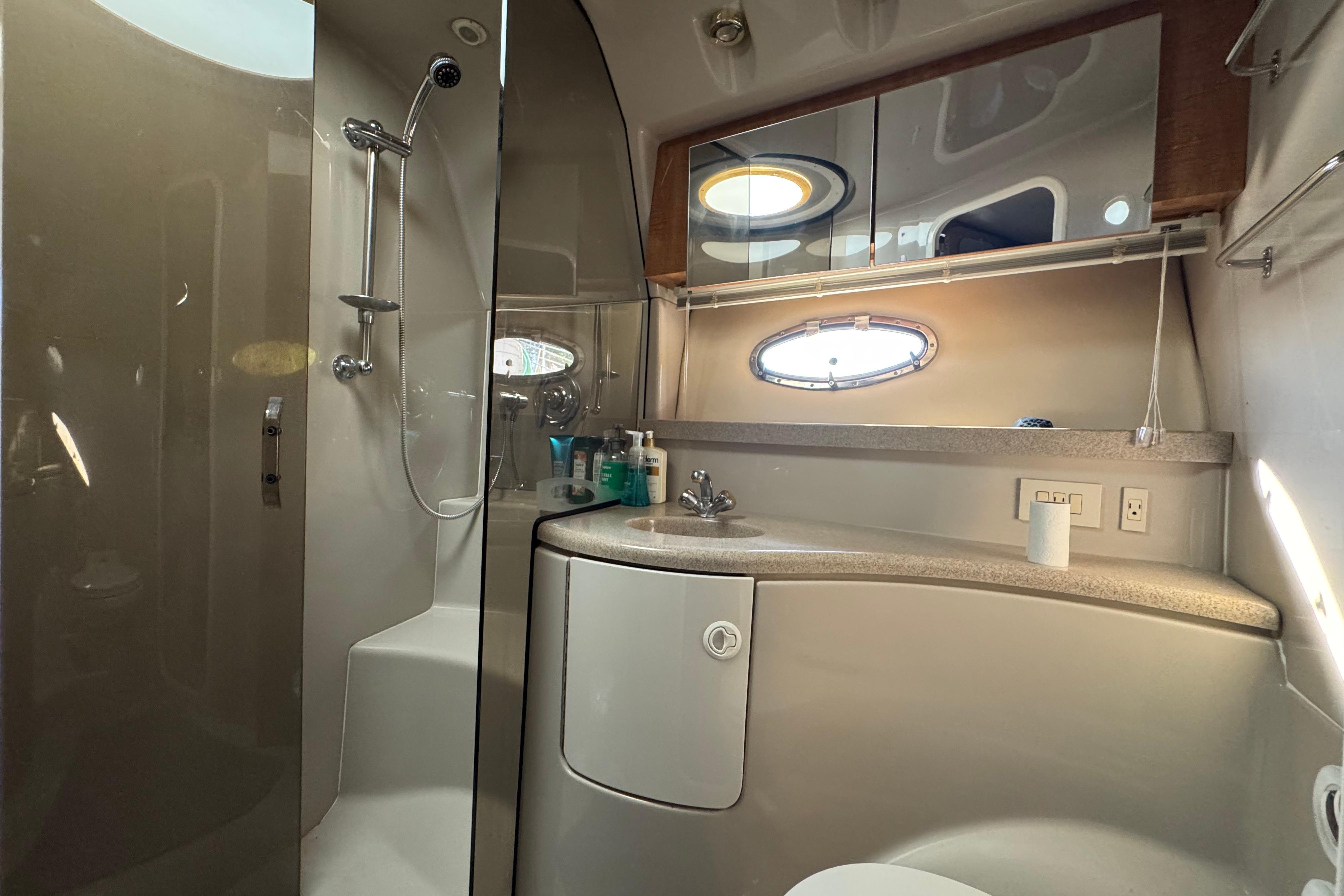 Luxurious bathroom in 2007 Regal Commodore 3860 yacht with modern fixtures and shower.