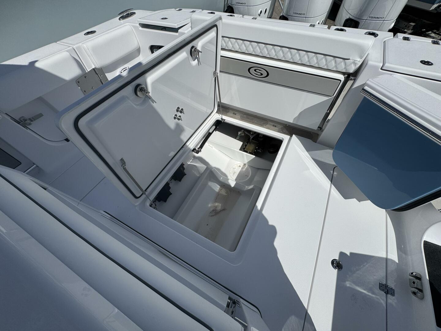 2025 Sportsman 352 Open boat with open storage compartment and sleek white interior design.
