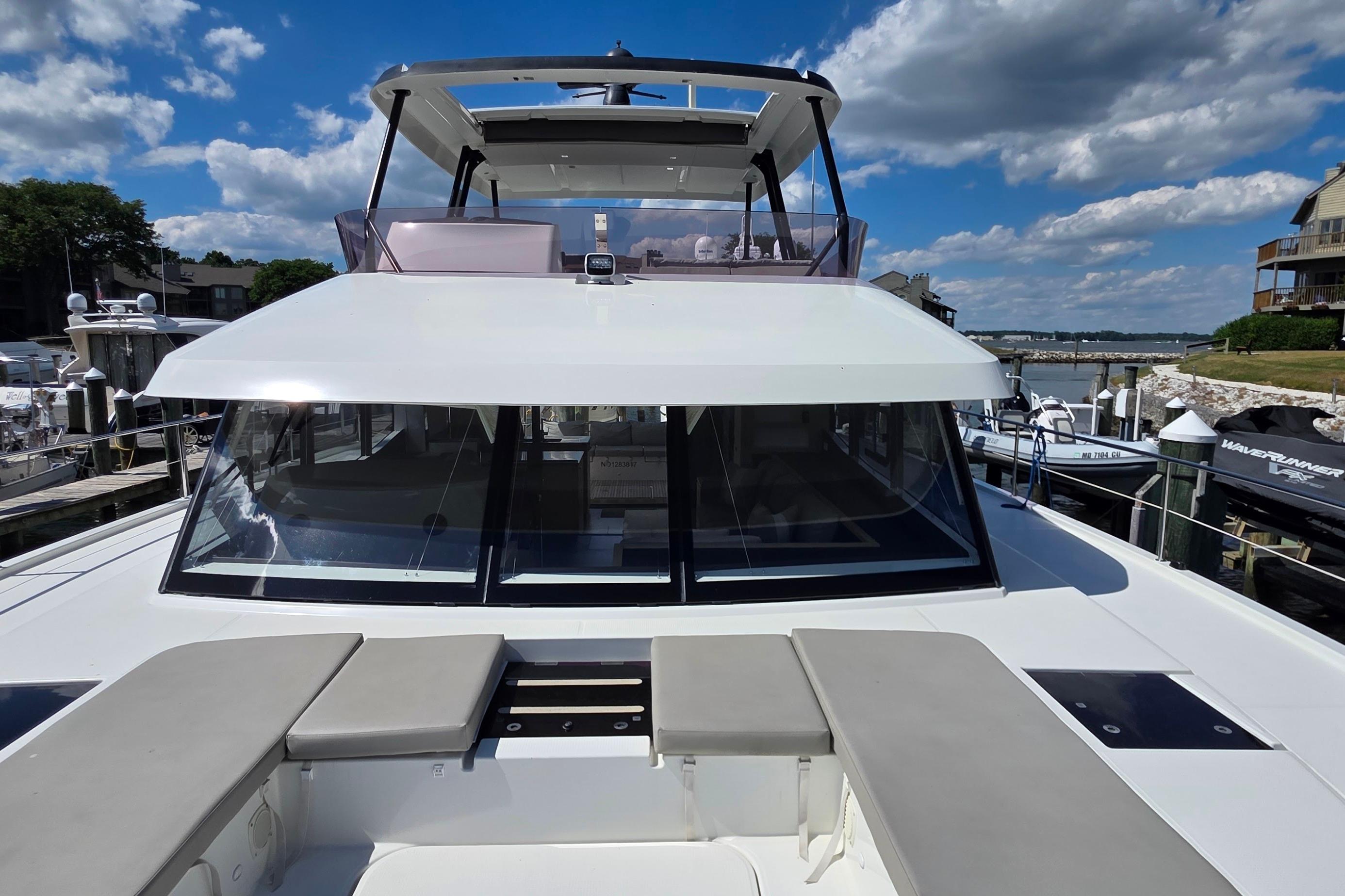 2018 Fountaine Pajot Motor Yacht 44 docked under a clear blue sky.