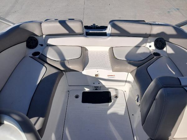 2010 Yamaha Boats 242 Limited interior with gray seating and speakers.