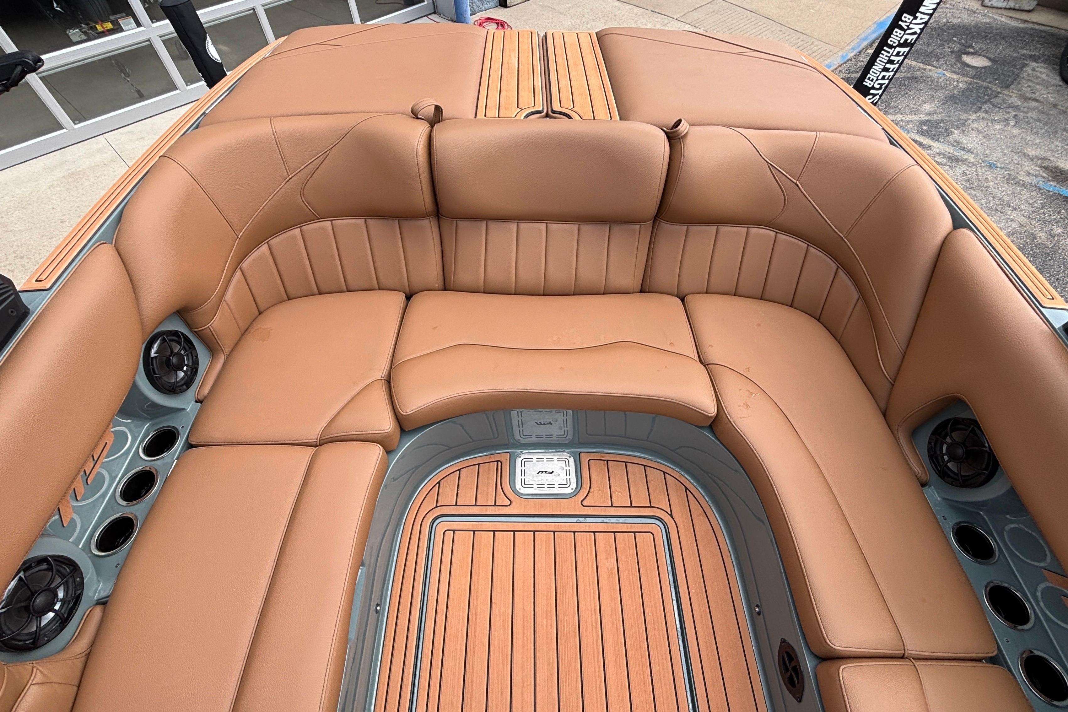 Luxurious interior of 2026 MB B52 23 Classic boat with tan leather seating.
