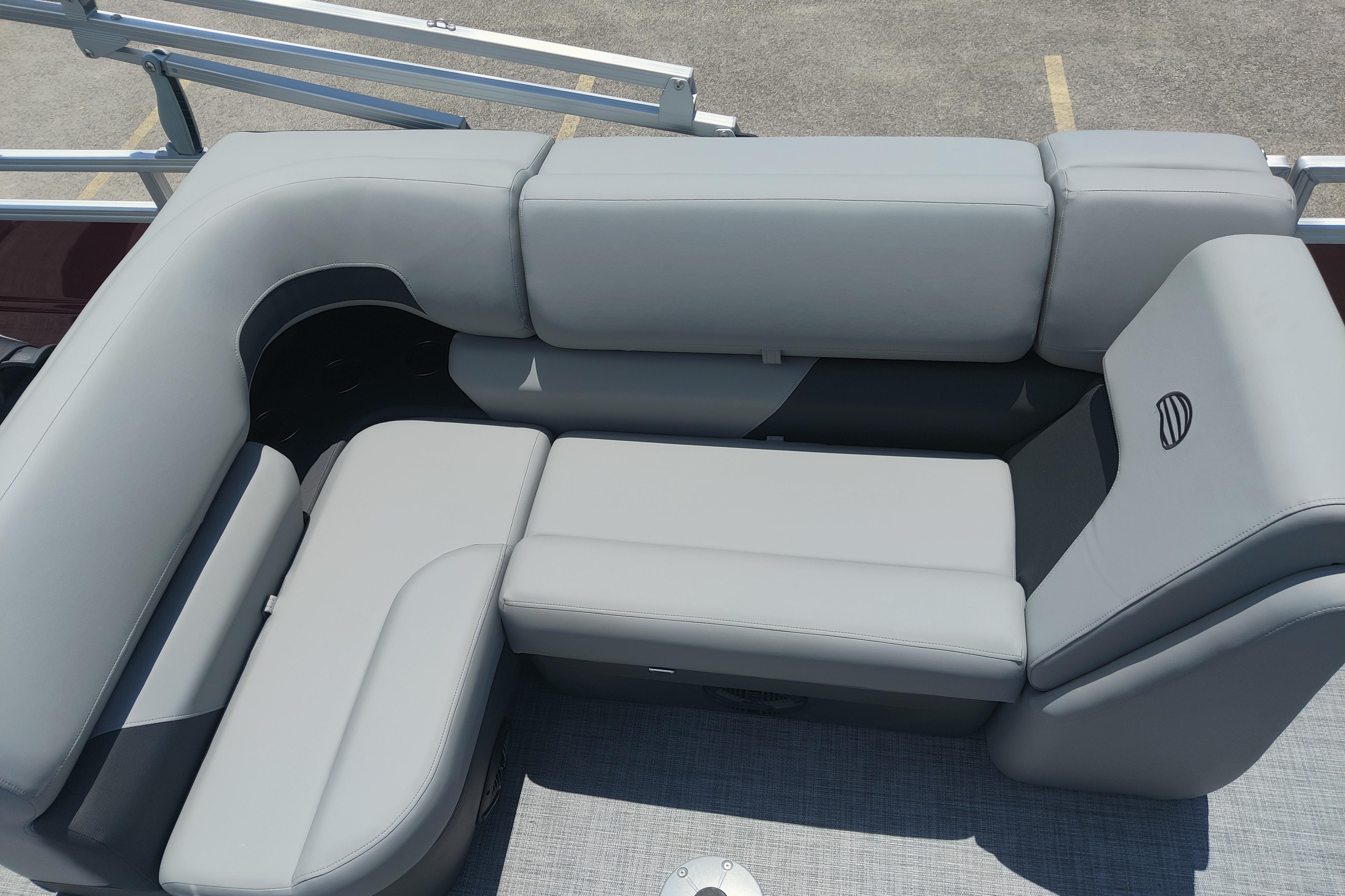 2026 Sun Tracker SportFish 22 DLX boat with sleek gray seating arrangement.