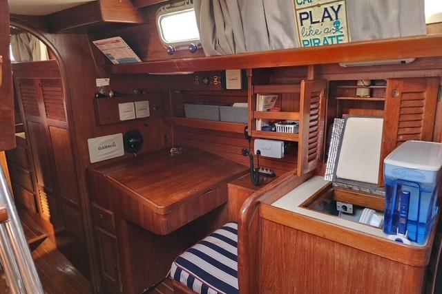 1984 Bristol 45.5 Center Cockpit interior with wooden furnishings and nautical decor.