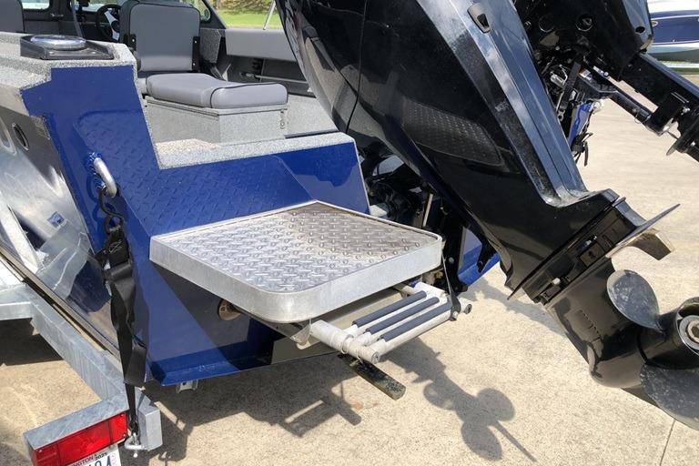 2023 Alumaweld Talon 18 boat with motor and rear platform detail.