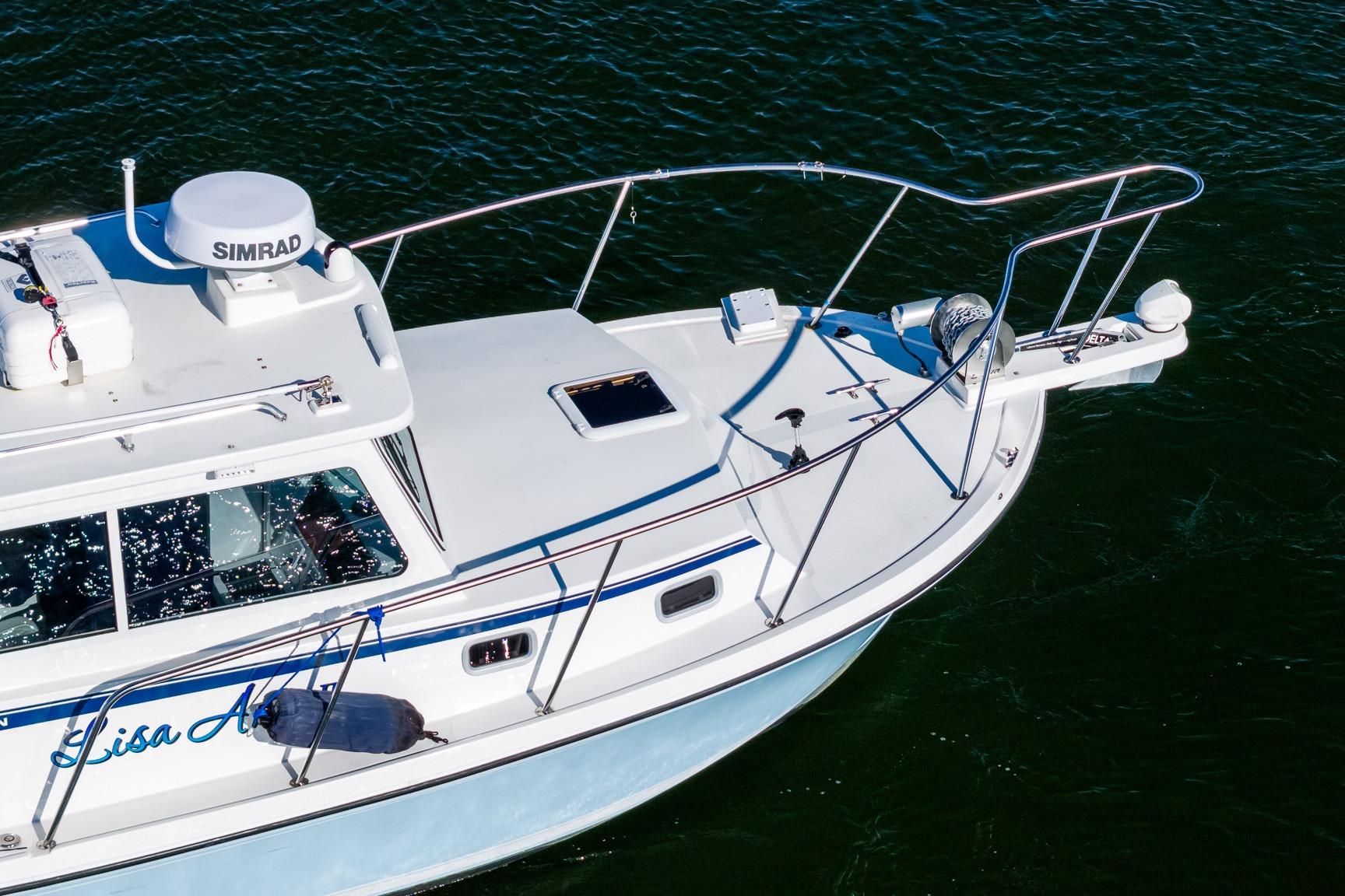 2024 Steiger Craft 31 Fisherman boat on water, featuring Simrad equipment.