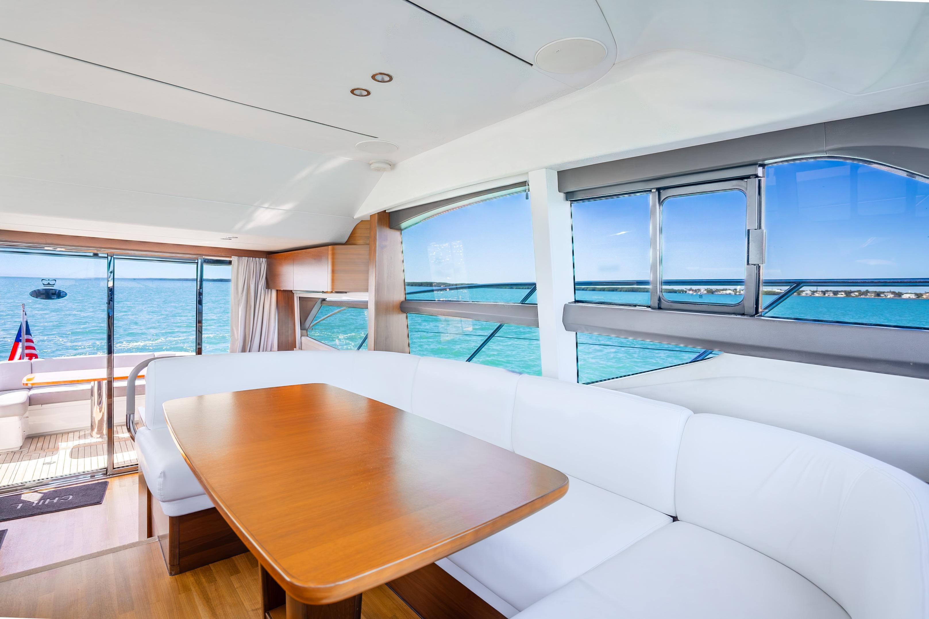 Luxurious interior of 2018 Princess F49 yacht with ocean view and elegant seating.