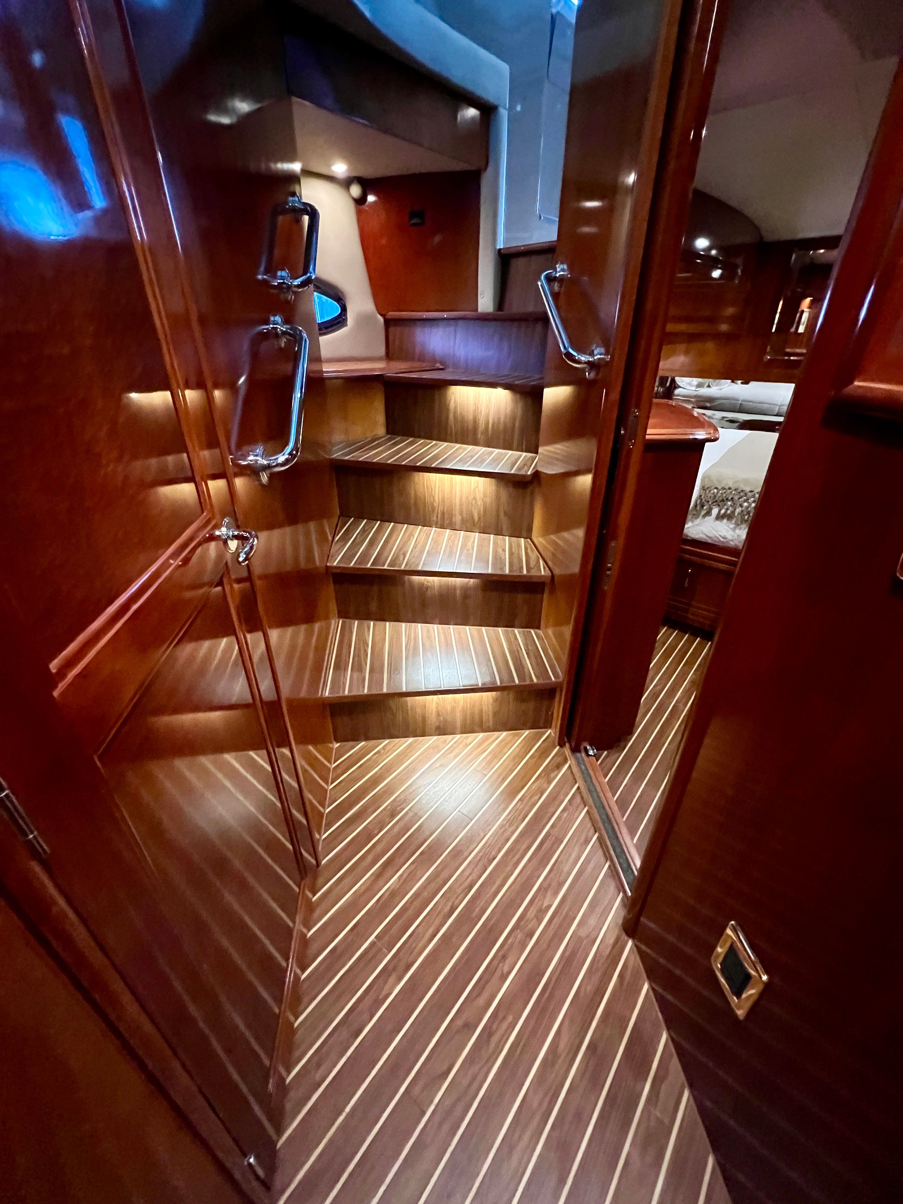 Interior of Carver 560 Voyager Sky yacht, stairs and wood finish.