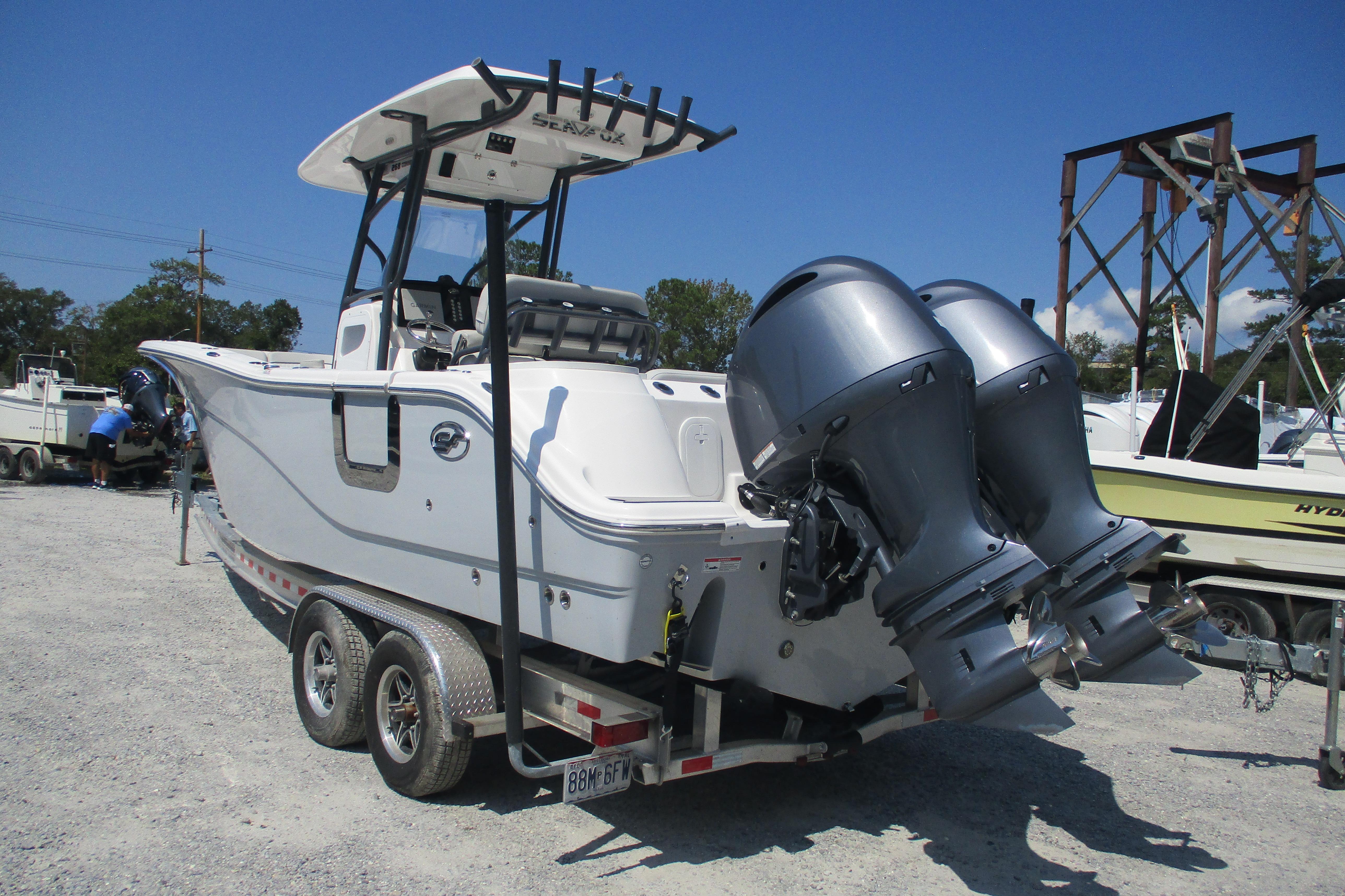 2024 Sea Fox 268 Commander boat on trailer with dual outboard engines.