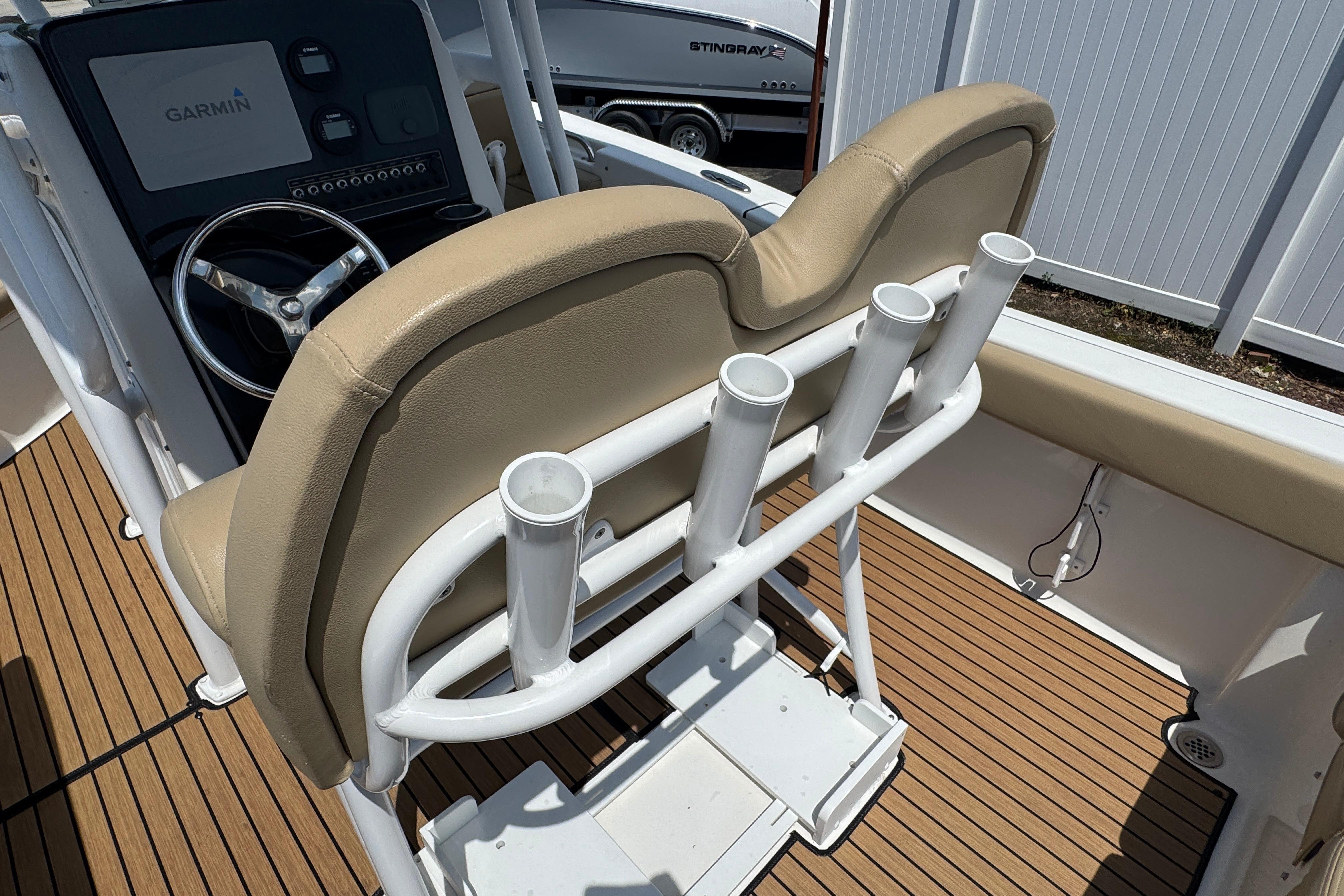2016 Tidewater 230 LXF boat interior with Garmin system and rod holders.