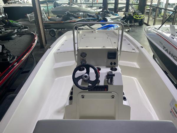 2024 Mako Pro Skiff 19 CC center console boat in showroom.