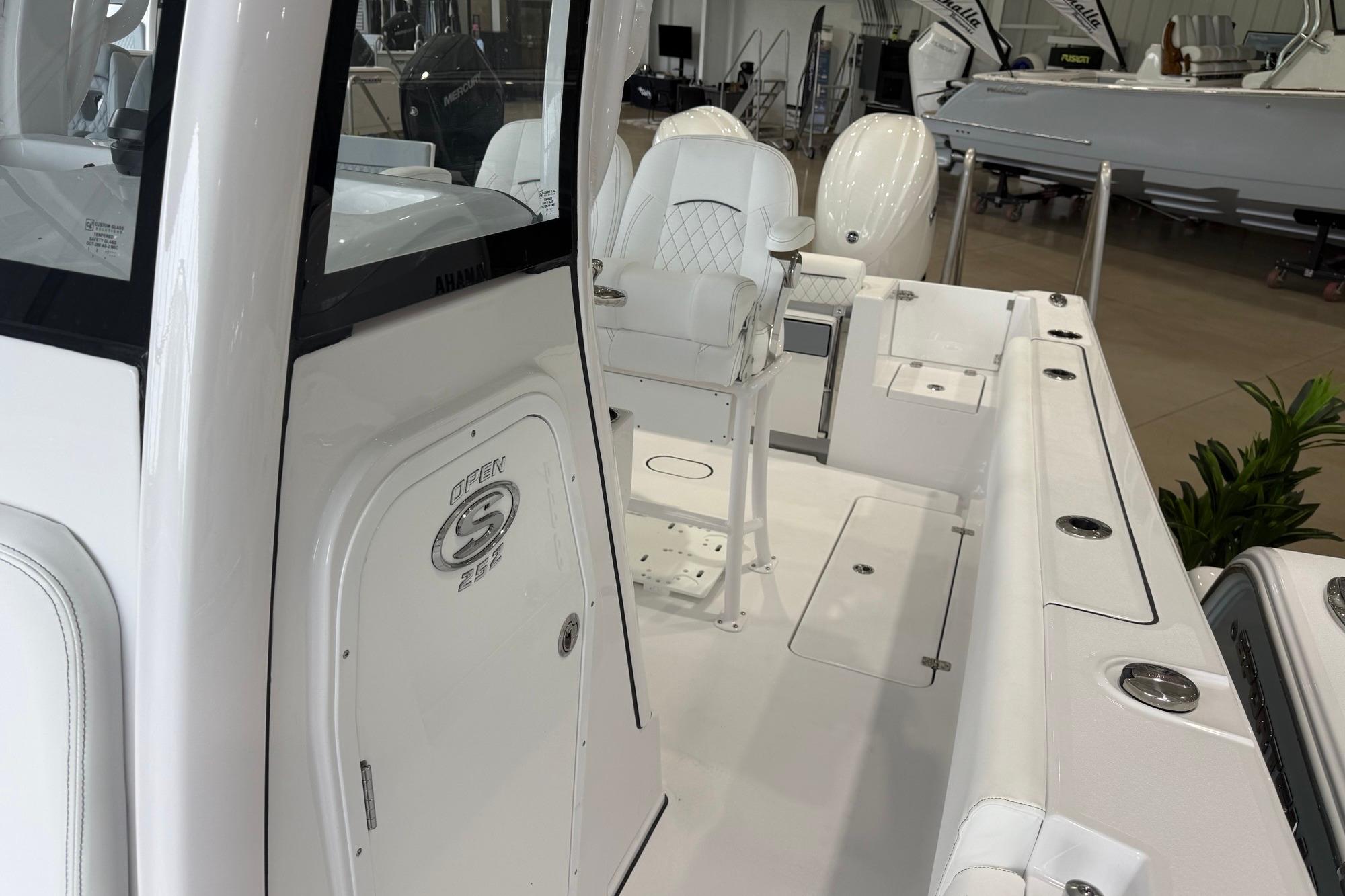 2026 Sportsman Open 252 Center Console boat interior with seating and storage compartments.