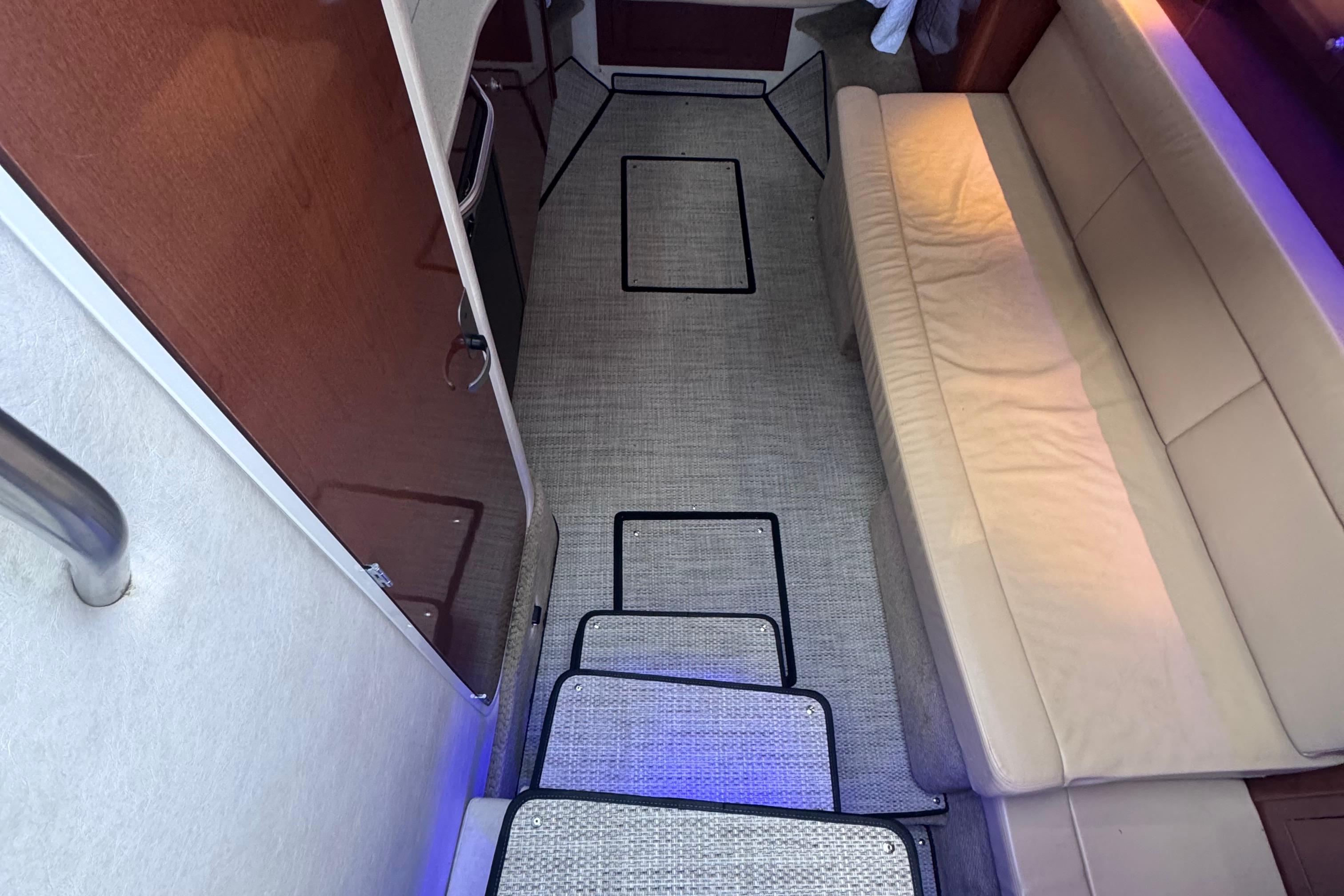 Interior of 2008 Sea Ray 350 Sundancer with beige seating and carpeted flooring.