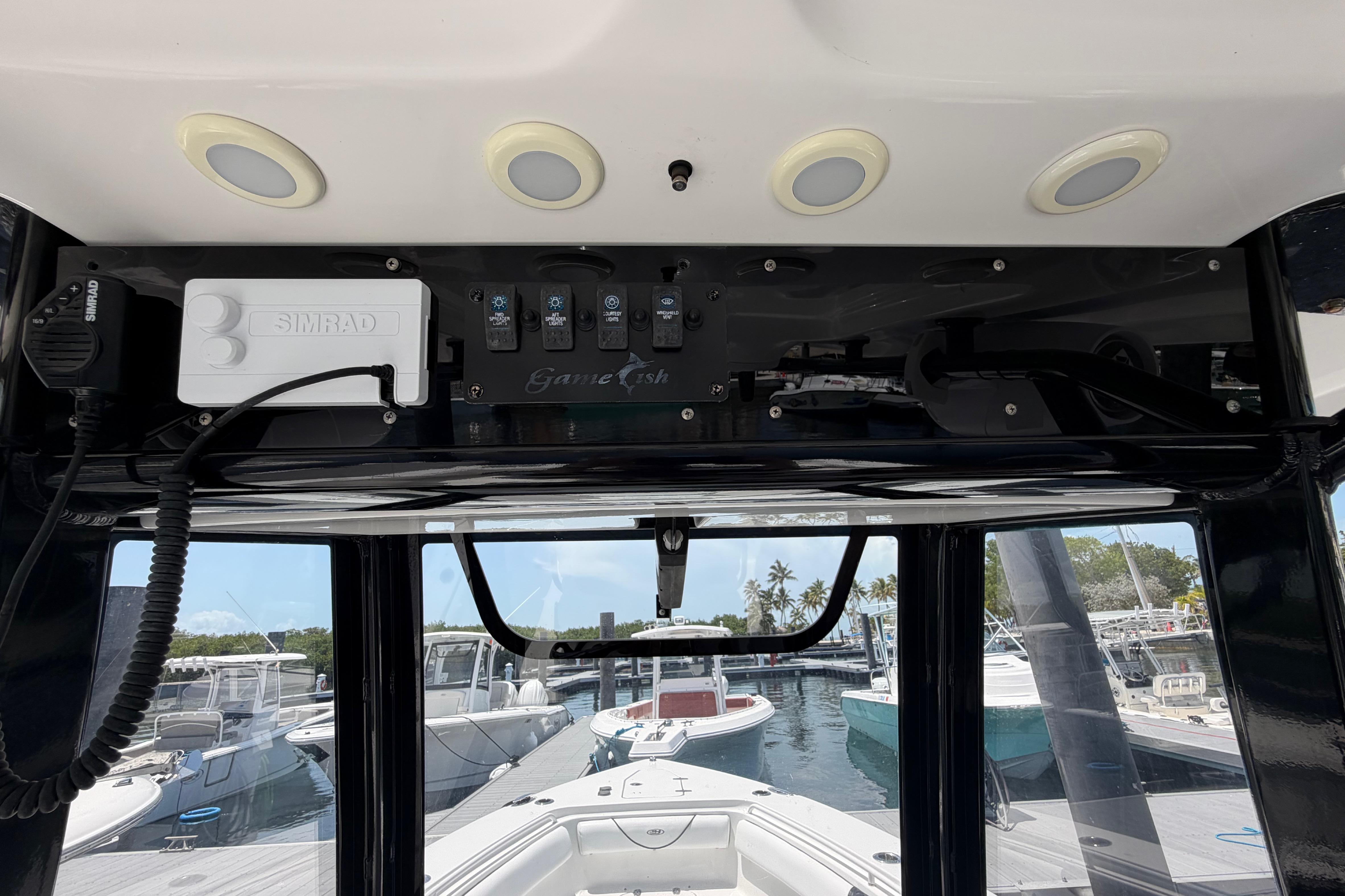 2019 Sea Hunt Gamefish 27 Coffin Box dashboard with Simrad electronics at marina.