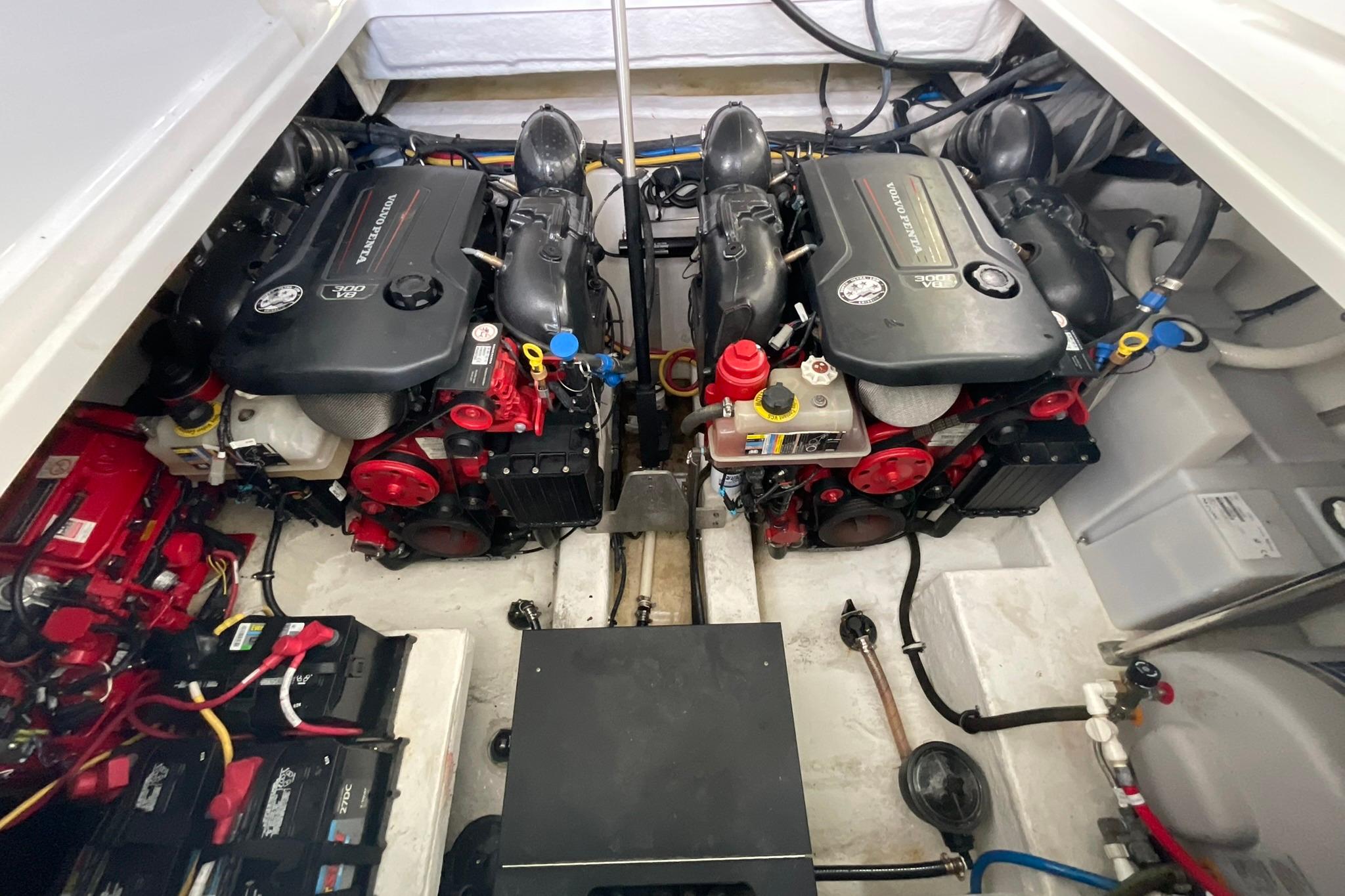 Engine room of a 2019 Monterey 335 Sport Yacht with dual engines and batteries.