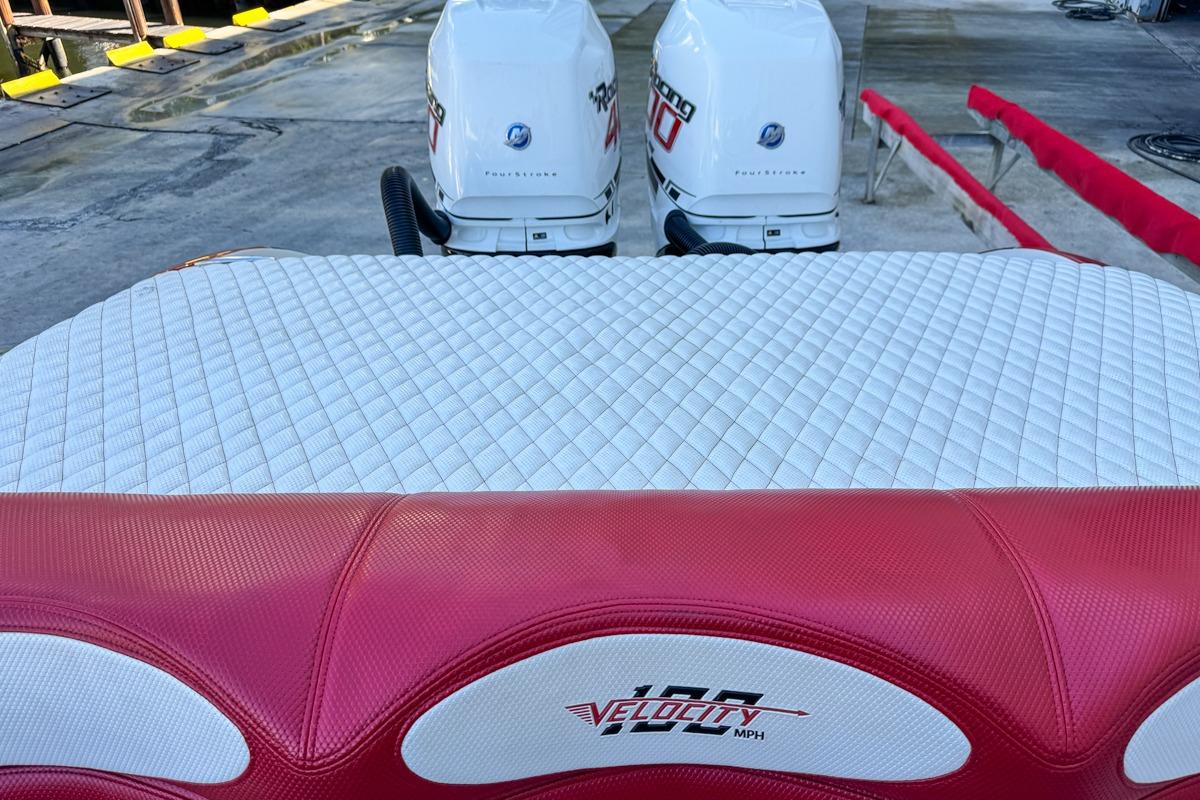 2022 Velocity 290sc boat with dual outboard engines and quilted seating.