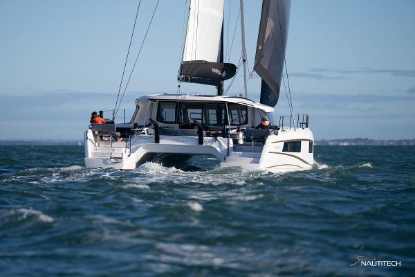 2025 Nautitech 48 Open catamaran sailing on open sea.