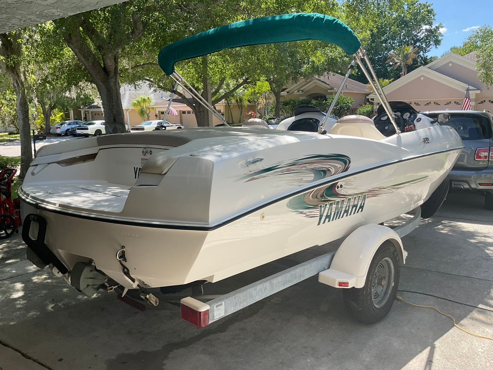 2000 Yamaha LS2000 boat parked on trailer outdoors.