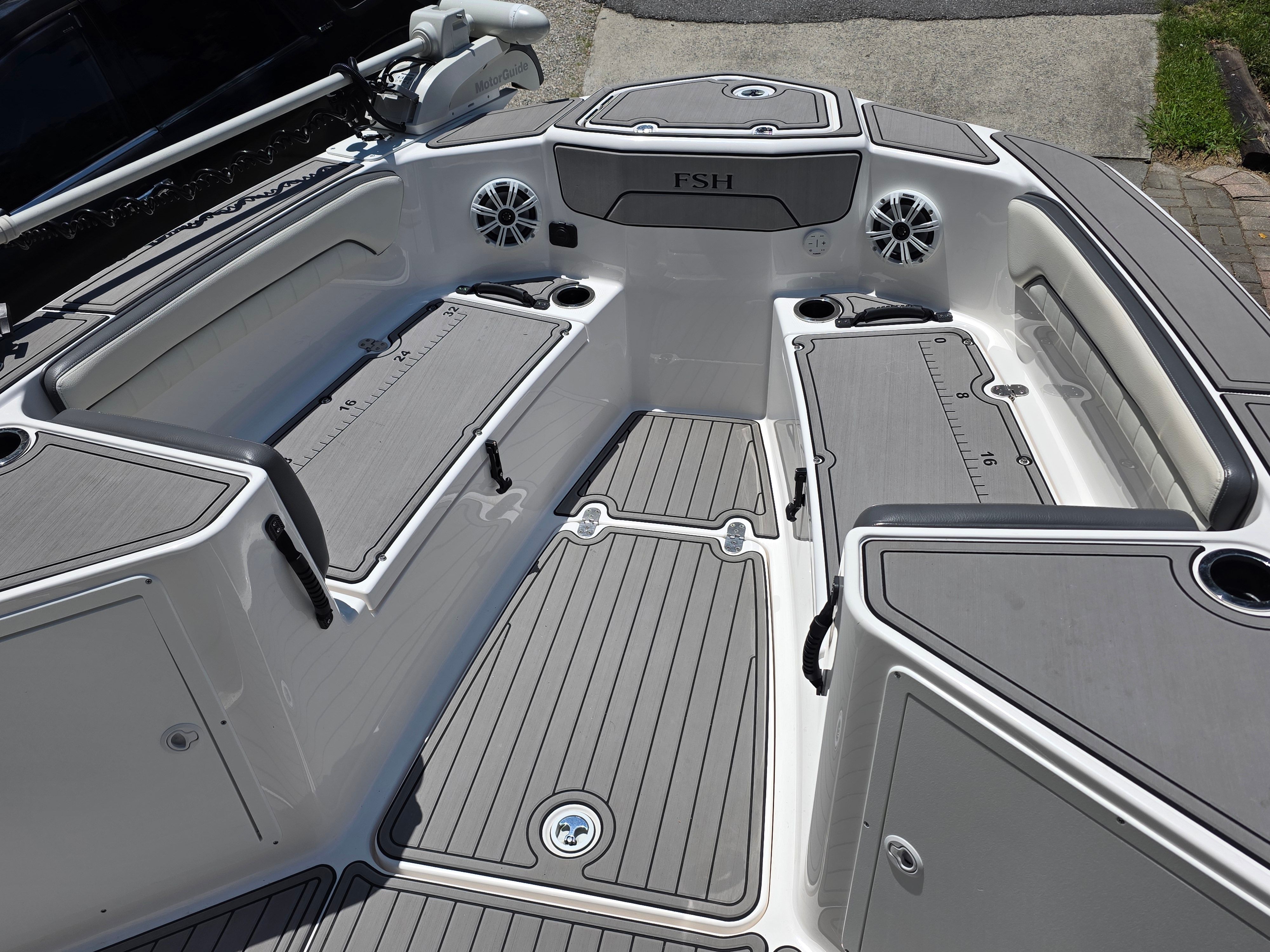 Interior of a 2020 Yamaha 210 FSH Sport boat with gray seating.