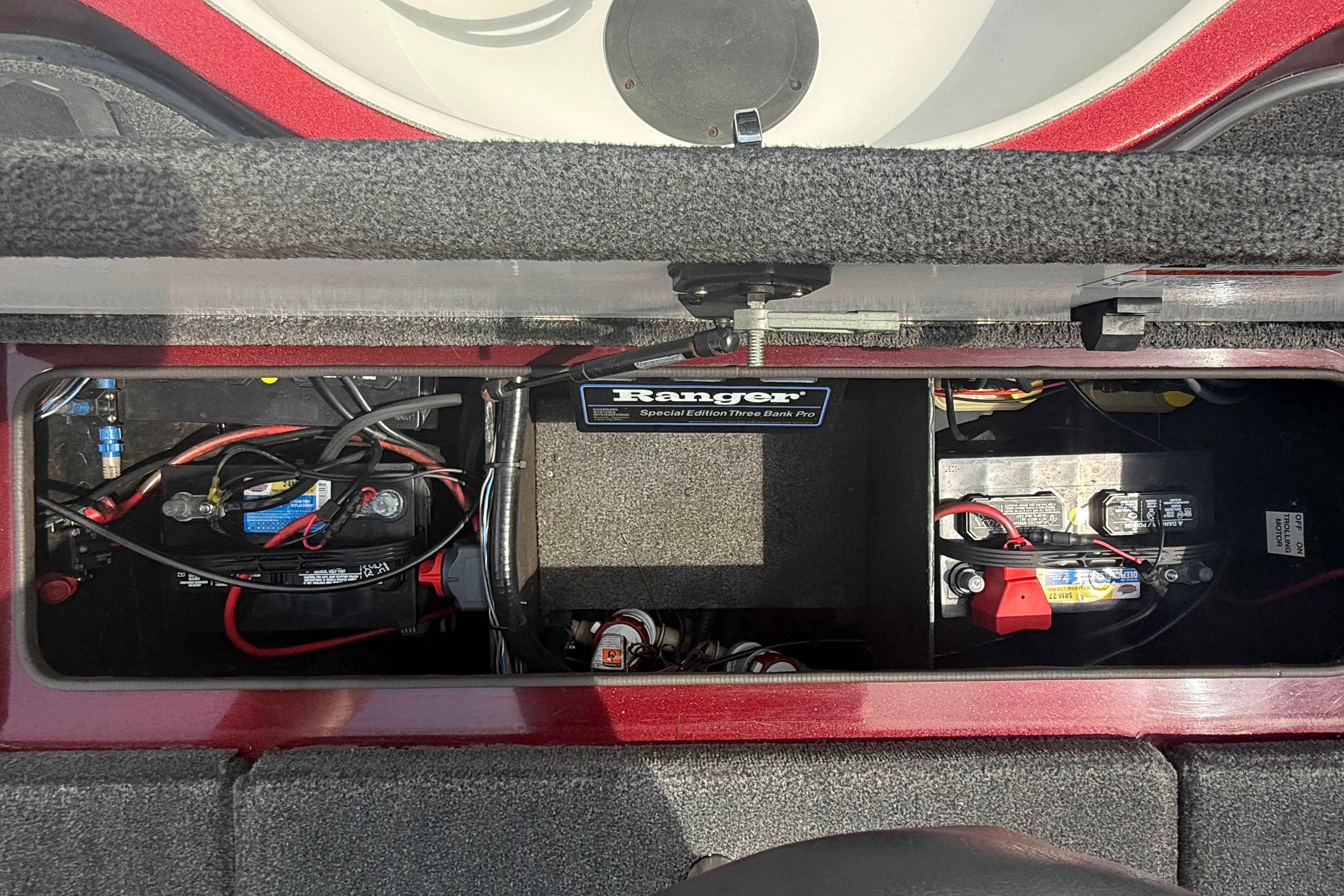 Battery compartment of a 2007 Ranger 519 VX boat, featuring wiring and components.