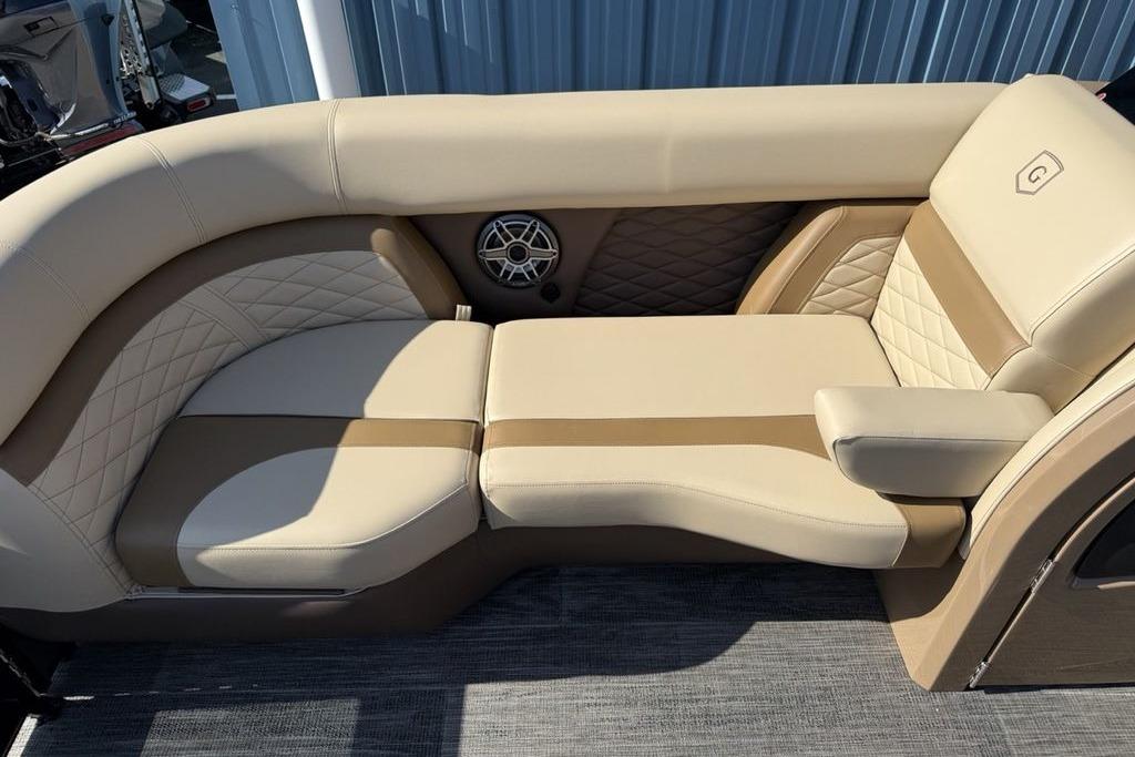 Luxurious seating on 2026 Godfrey Monaco 235 SB boat, featuring beige upholstery and stylish design.