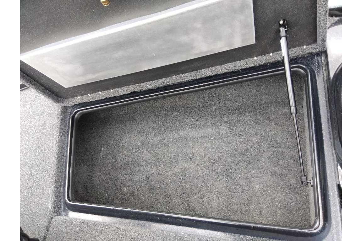 Open storage compartment in 2026 Nitro Z17 boat, featuring a hydraulic lift support.