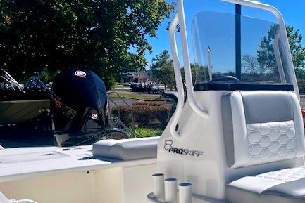 2026 Mako 18 Pro Skiff boat with sleek design and powerful outboard motor.