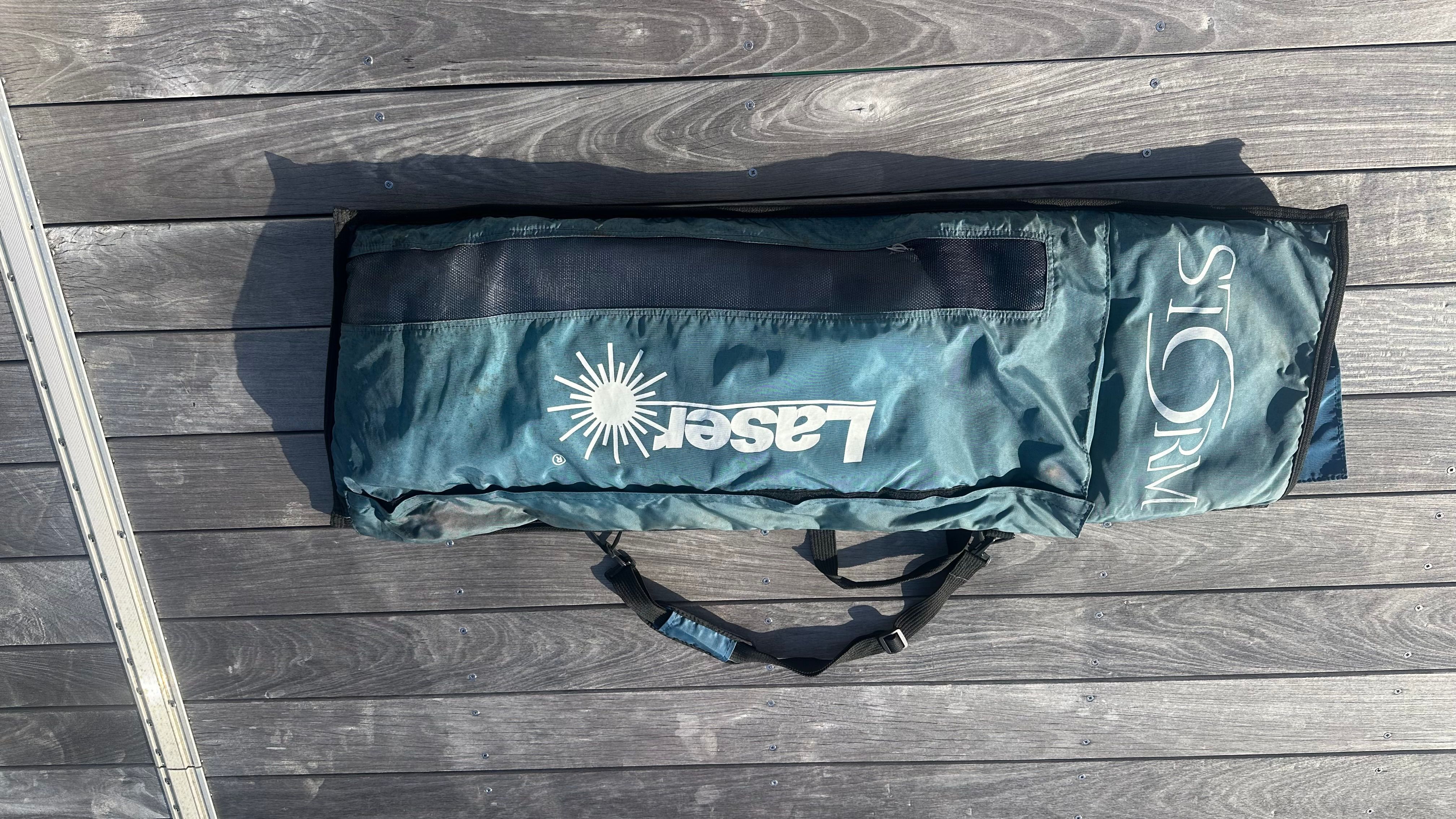 A Laser XD bag is lying on a wooden deck.
