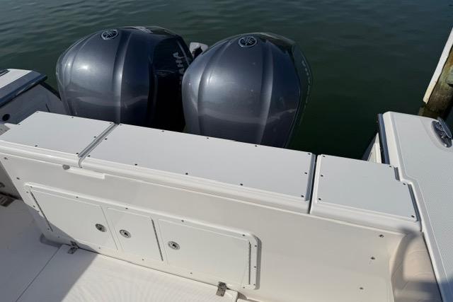 2014 Southport 29 FE boat with dual outboard engines on calm water.