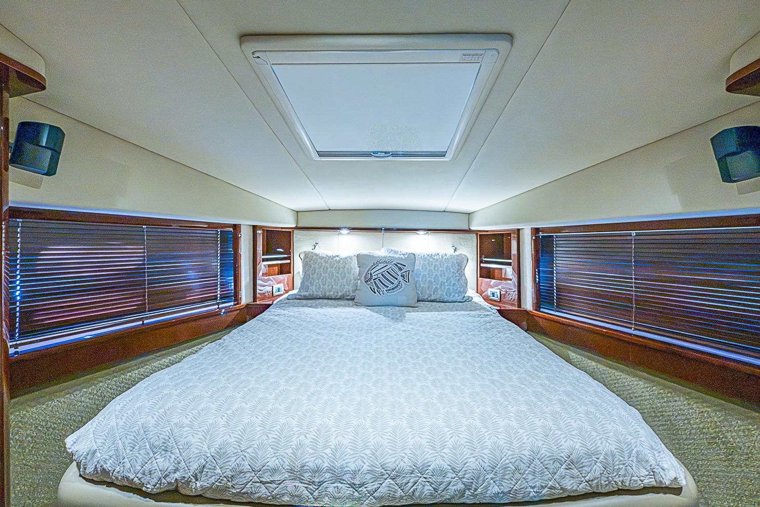 Luxurious bedroom interior of 2008 Sea Ray 60 Sundancer yacht with elegant bedding.