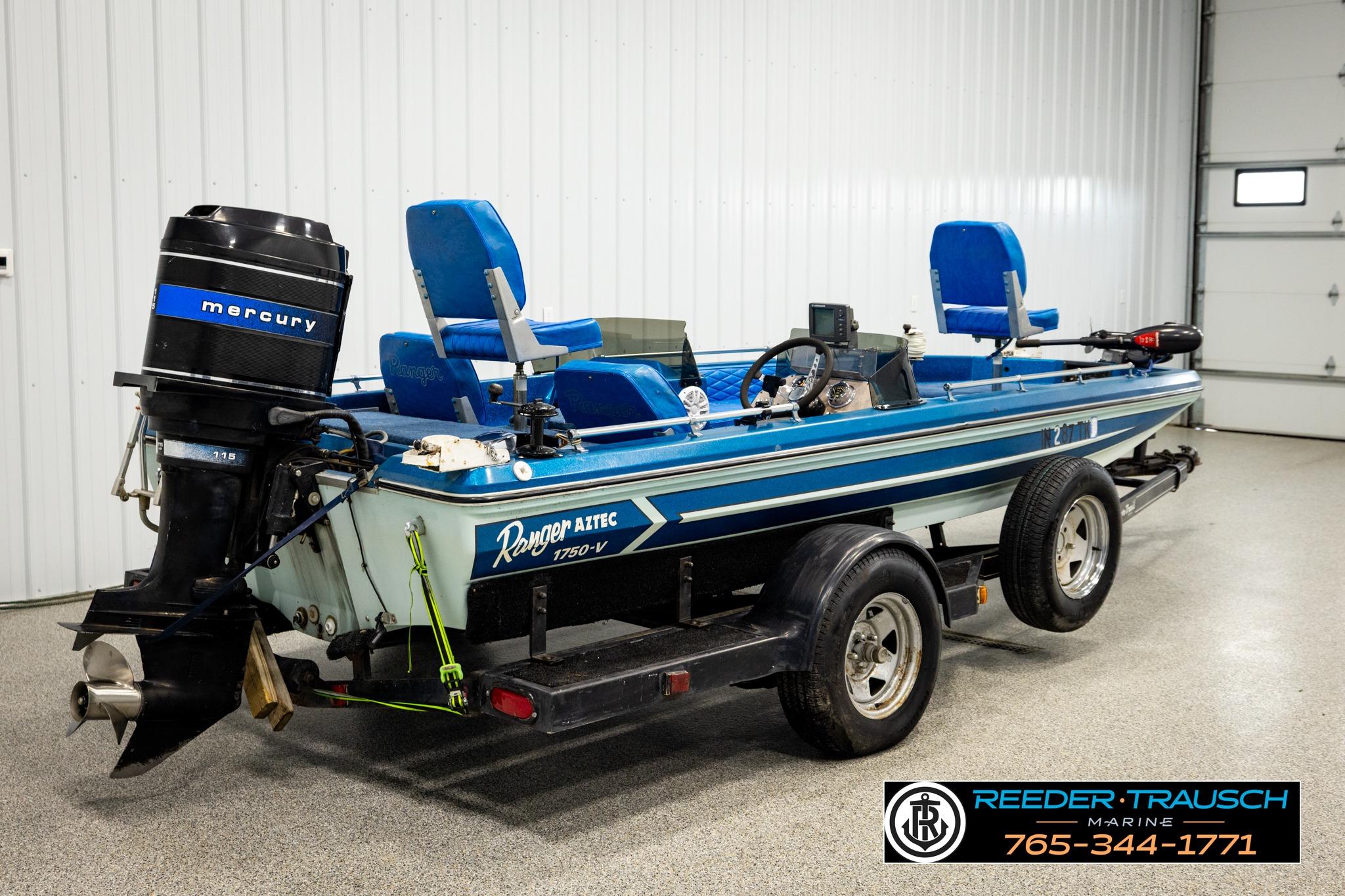 1980 Ranger 175 VS boat with Mercury outboard motor on trailer in garage setting.