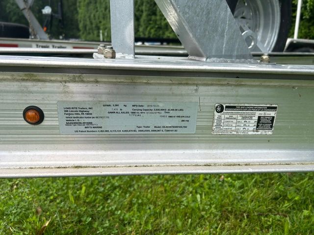 Close-up of a boat trailer with manufacturer label and technical information.
